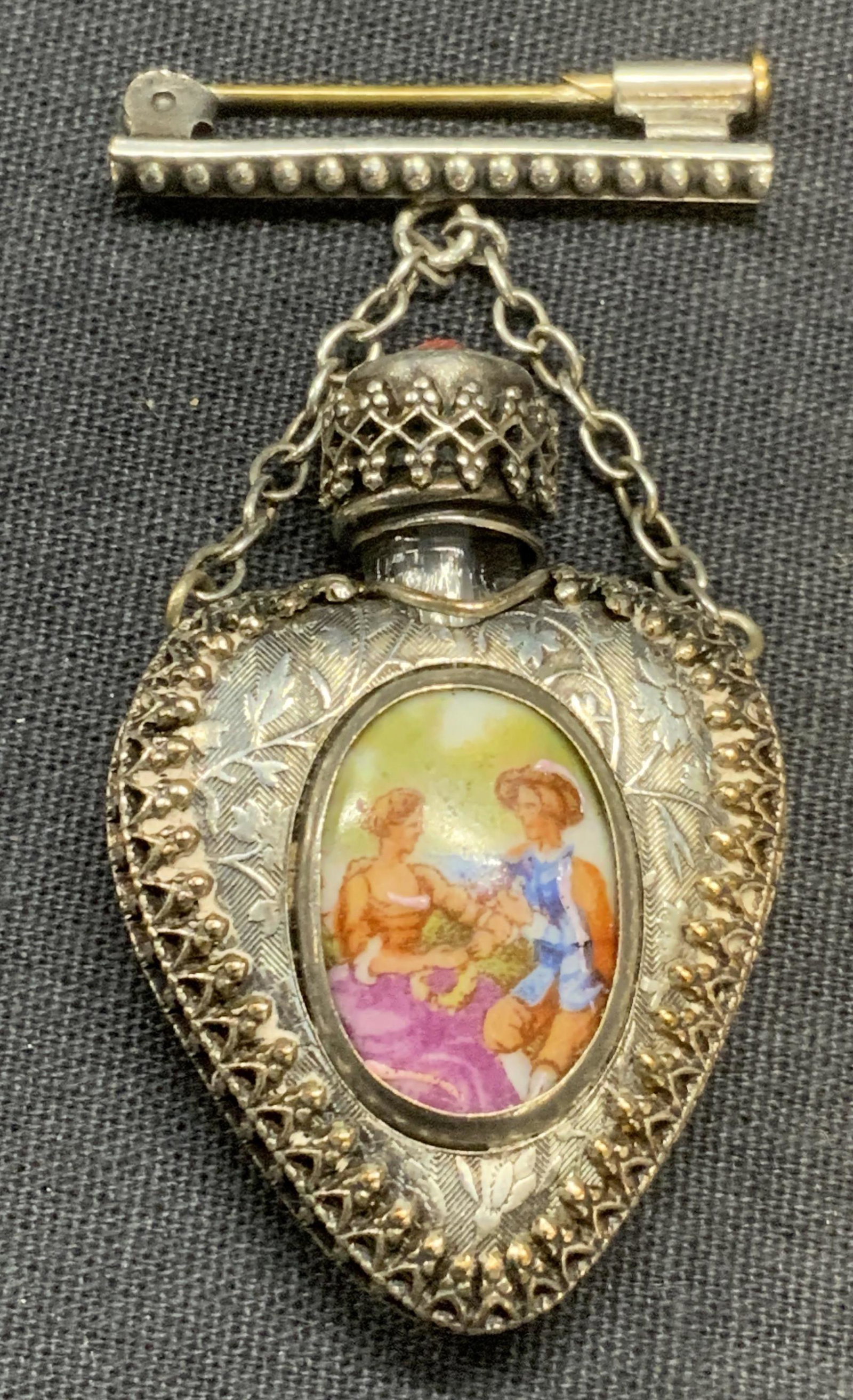 Vtg LIMOGES Snuff Bottle Heart Brooch France: Vintage Limoges figural porcelain decorated silver tone metal heart shaped snuff bottle brooch. Trademarked Limoges to reverse of porcelain. In good condition. Made in France. Heart snuff bottle measu