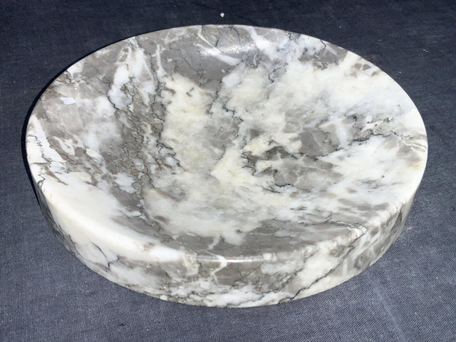 7 Inch Gray & White Marble Tabletop Dish: 7 Inch diameter gray and white toned marble dish with curved indented top, possibly soap dish. Approximately 1 inch tall. Minor wearing to edge and to underside. Property of Manhattan estate, Asian ar