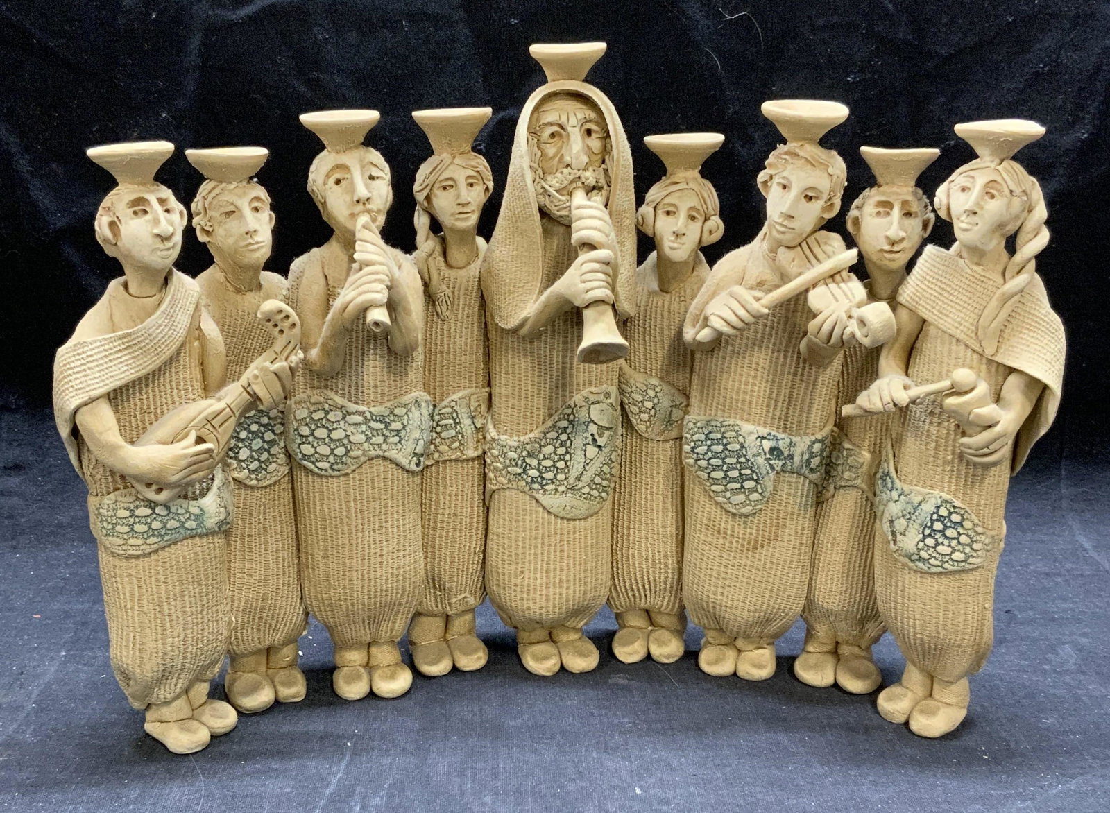 SUE TREUMAN Figural Art Pottery Menorah: Sue TREUMAN figural art pottery menorah. Signed to underside. Some surface wear consistent with exposure. Measures approx. 11 x 2.75 x 8.25 inches. Sue TREUMAN, Sue TREUMAN menorah, sue TREUMAN potter
