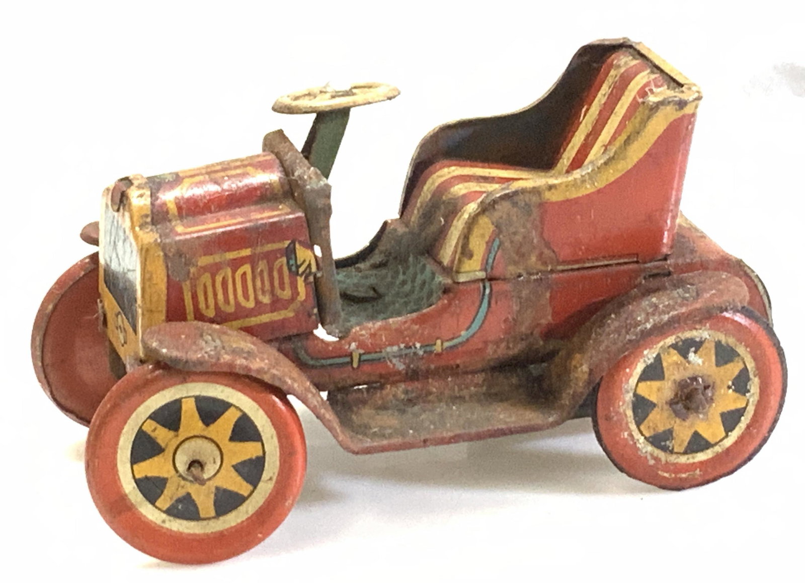Vintage TKK Friction Metal Toy Car, Japan: TKK Japan Tin Friction Car painted red, signed Japan. Measures 3.25 x 2 x 2 in. Surface wear, some rusting, all consistent with age and exposure. Wheels move. TKK Japan 3 in. Friction Old Timer car, V