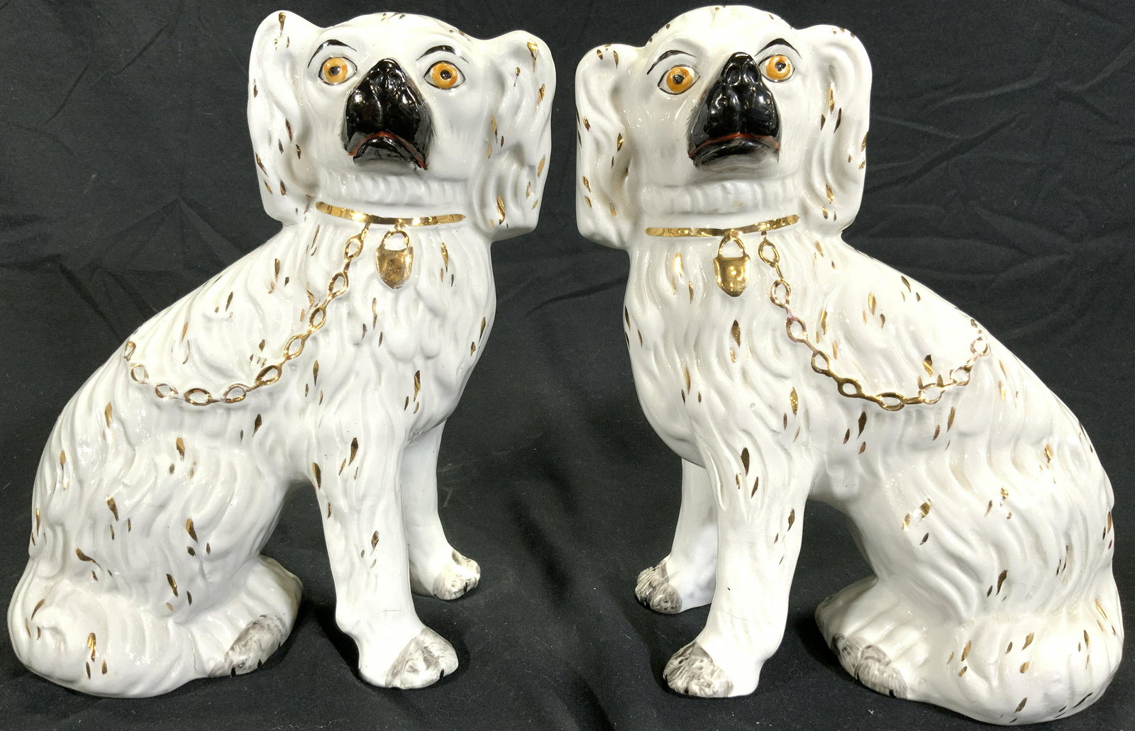 STAFFORDSHIRE Pr Antique Porcelain Dog Statues: Undersides are signed STAFFORDSHIRE ENGLAND. Lot includes 2 hound figures. Each hound figure is white with gold gilt detail. Pieces are vintage possibly antique. Each piece is porcelain. Undersides ea