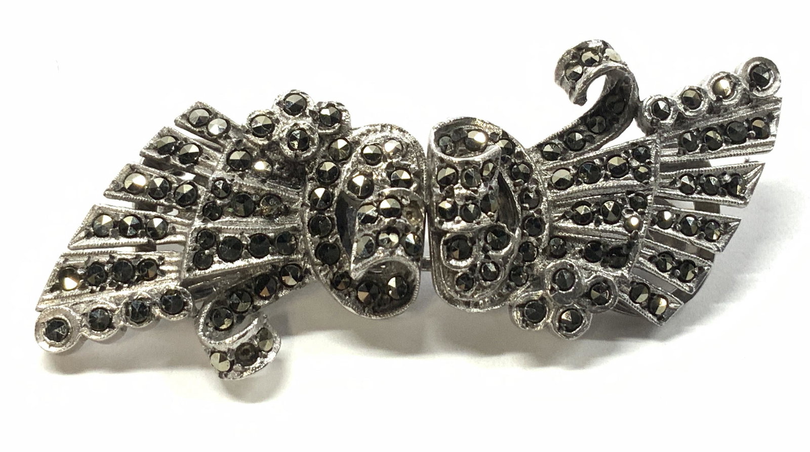 Sterling Silver Marcasite Art Nouveau Brooch: Vintage sterling silver and Marcasite jewelry, 2 in one wearable. Acts as a brooch, and separates into 2 clips, either for shoes, a bracelet. All pieces are marked silver and test positive for sterlin