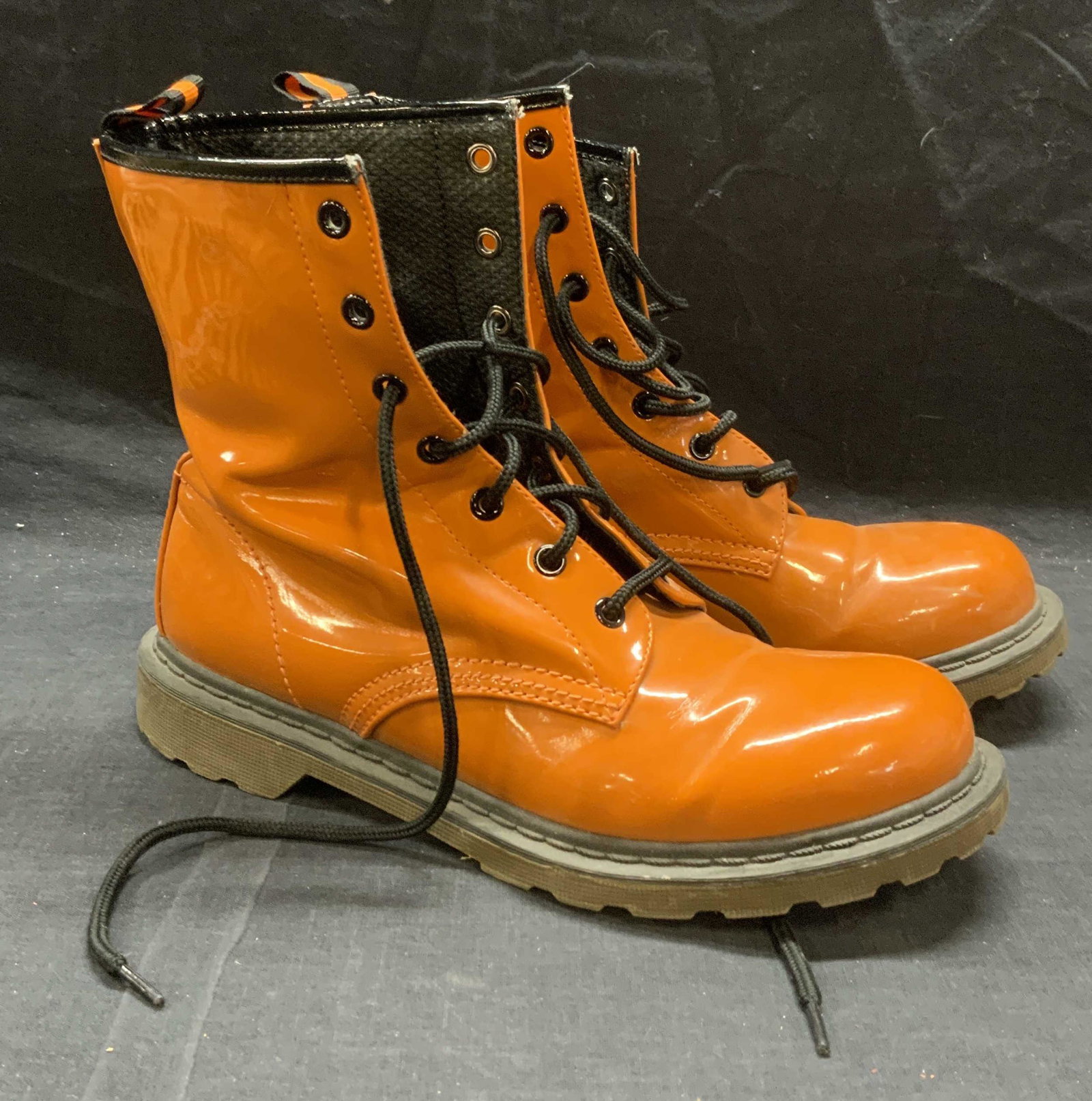 NO BOUNDARIES Orange Faux Leather Boots: No Boundaries orange faux patent leather boots. Size 10. Designer label to sole. All man made material. Some wear to material consistent with exposure. No boundaries, no boundaries boots, ladies desig
