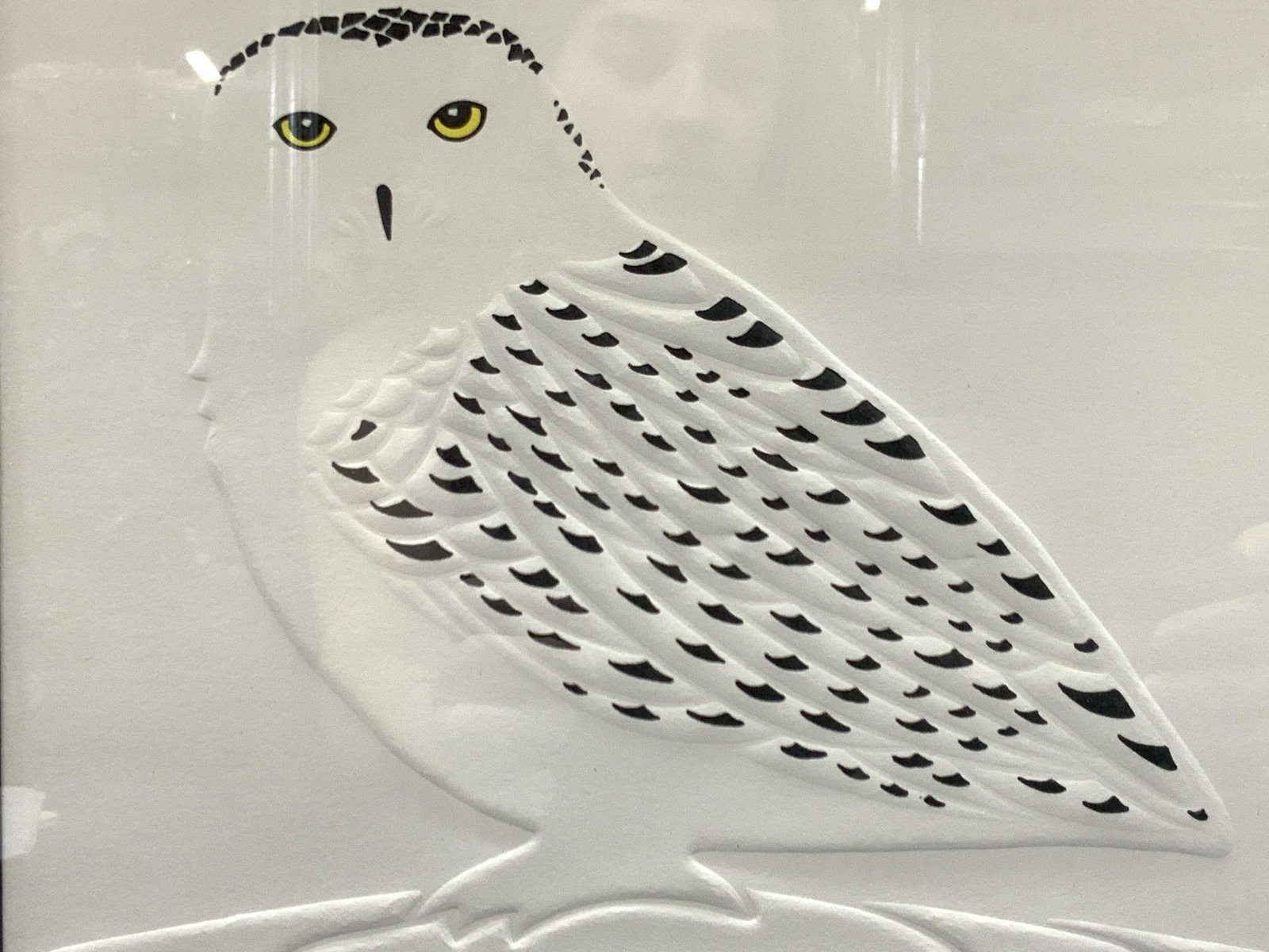 Jay Greene Signed Snowy Owl Embossed Paper Art: Singed Jay Greene in graphite, 166/400 Snowy Owl.Embossed image of a snowy owl with black accents and impressed details of the body and feathers.Framed in black plastic frame with off white mat board.