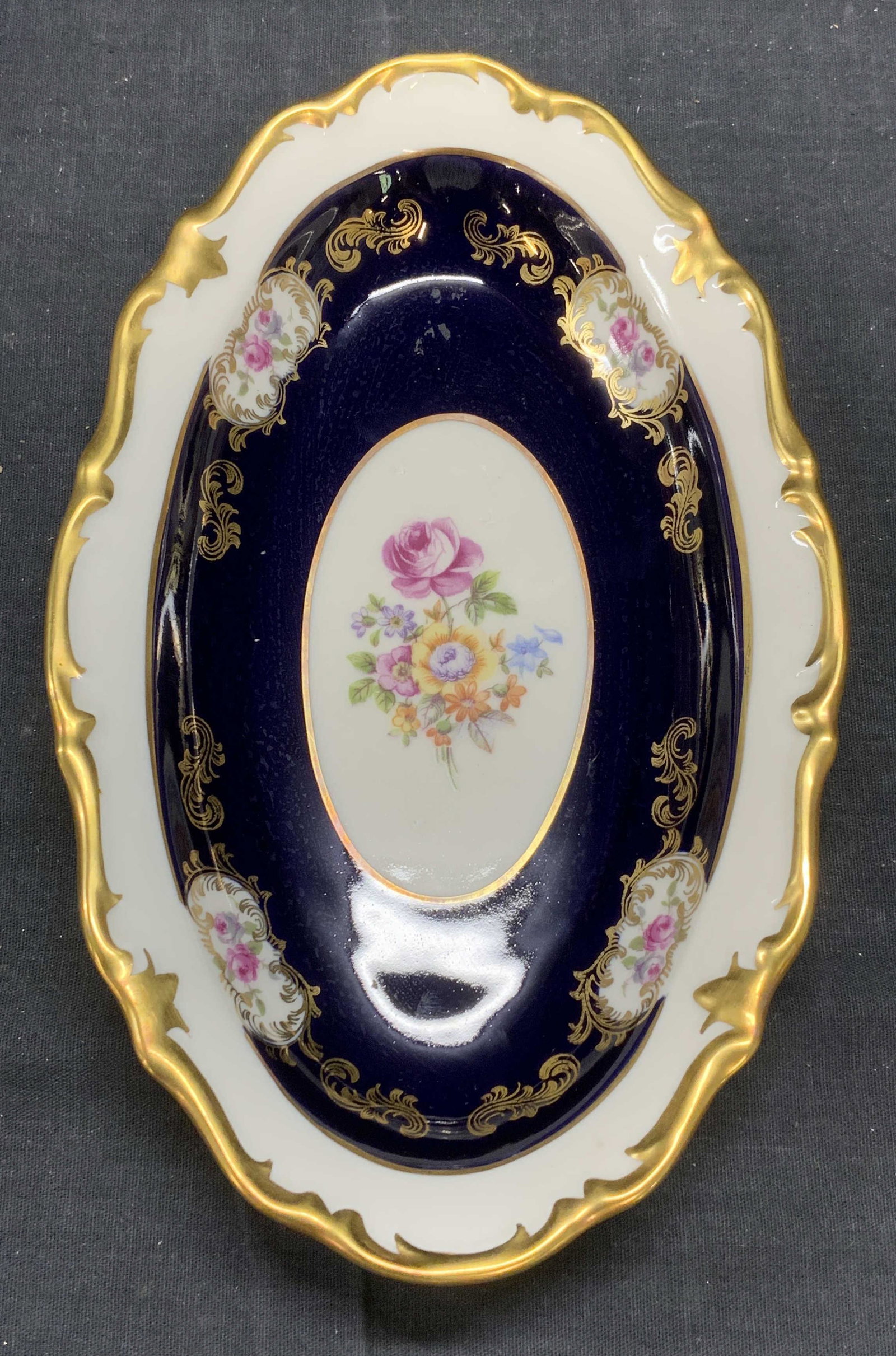 Vintage PM&M Cobalt Fine China Dish, Germany: Vintage PM&M cobalt blue and gilt decorated fine china dish with floral motif. Trademarked to underside. Made in East Germany (German Democratic Republic). Some surface wear consistent with exposure. 