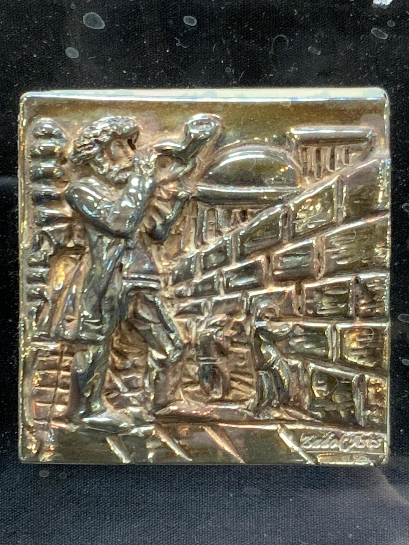 ZADO ARTS Sterling Stamped Israeli Art: Marked on right corner ZADO, 925 Marked on sticker on backside that reads, handcraft made of sterling silver 925. Designed and produced by ZADO Arts LTD Israel. Depicts raised image of a man blowing a