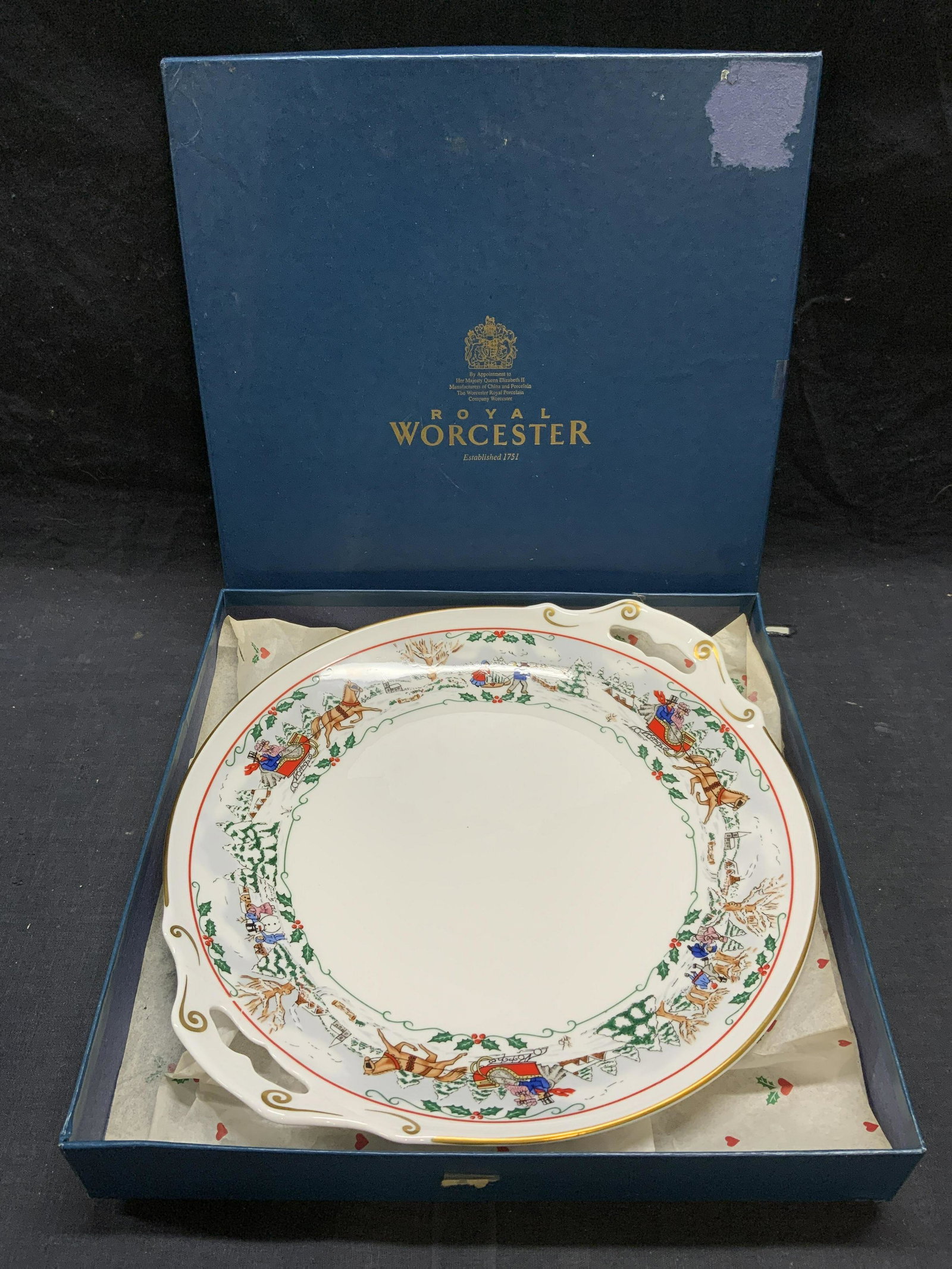 ROYAL WORCESTER Village Christmas China Platter: Vintage Royal Worcester fine bone china 1990 Village Christmas pattern serving platter with figural and carriage motif and gilt decoration. Made in England. Platter measures approx. 12.25 inches wide.