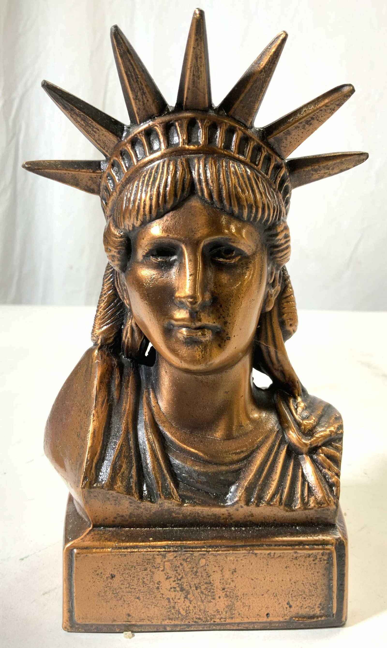 SEVILLE Copp Statue Of Liberty Bust Coin Bank USA: Backside of base reads SEVILLE USA. Bank appears to be copper, possibly copper over pewter. Piece depicts bust of Statue of Liberty. Backside has coin slot. Measures approx 7 inches tall 4.25 inches w