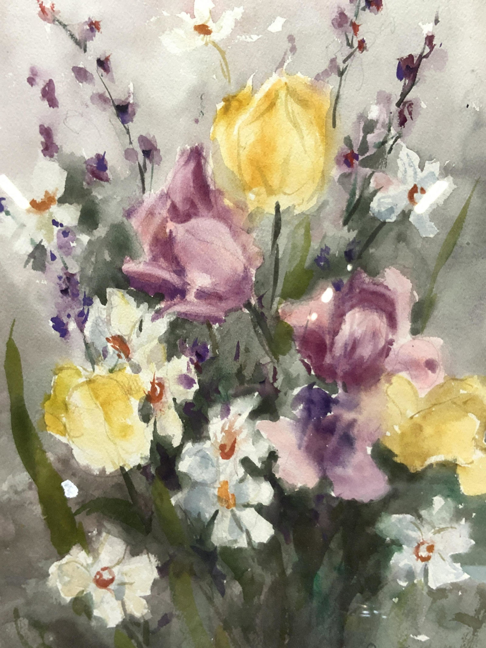 E.Ryan Signed Floral Watercolor Painting: Signed on lower right corner E.Ryan. Subject depicts a cluster of flowers, tulips, roses sand daisies. Framed in gold metal leafed wooden frame with off white and magenta other mat boards. Approximate