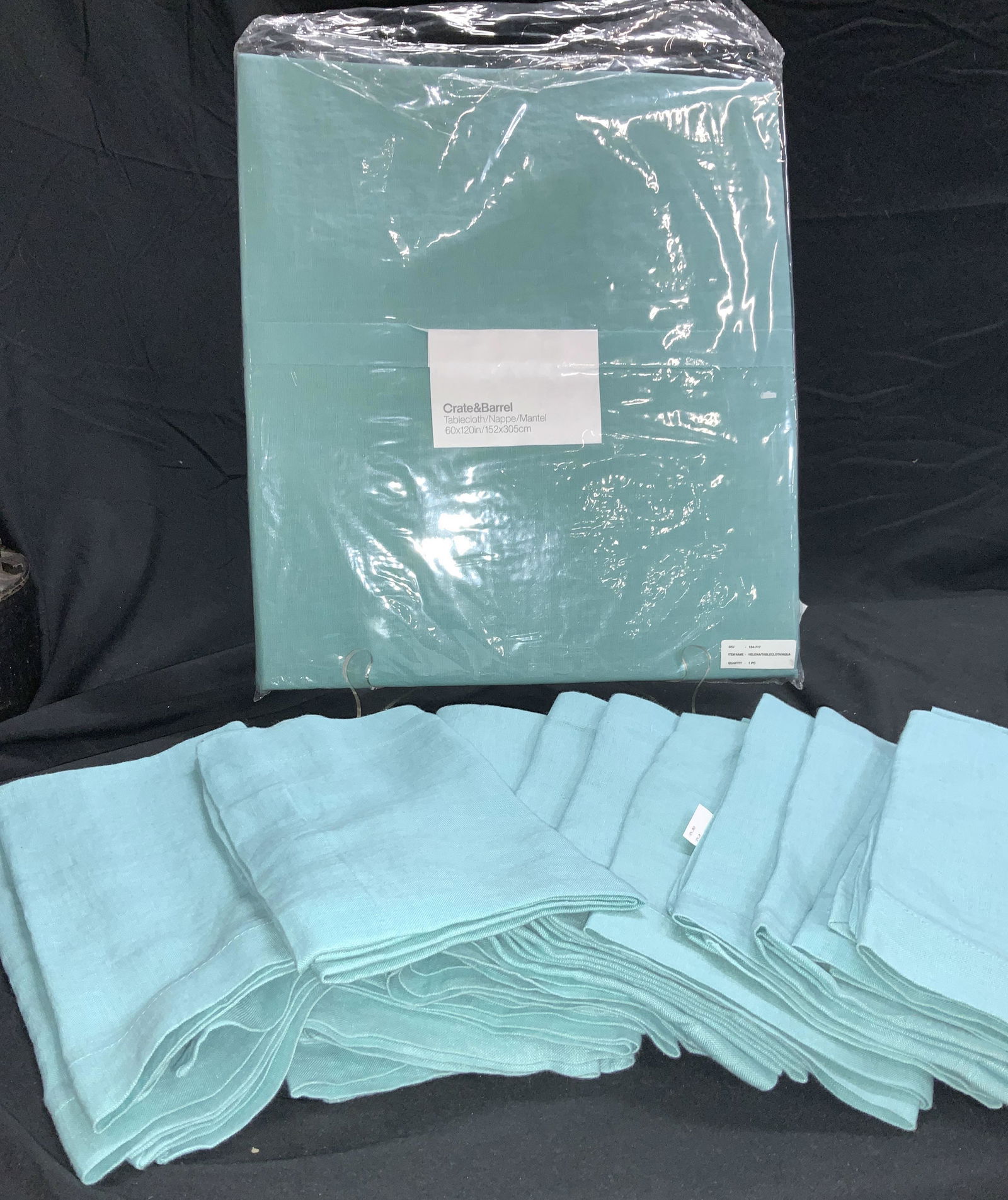 Crate&Barrel Linen Tablecloth& Napkin Set 17 NIP: Crate&Barrel rectangular tablecloth ( 60 x 120 in.) and matching napkins ( 16 total) . 100% linen , called Helena AQUA. Tablecloth is new n package) Dinner napkins measure 22x 22 in. New w/Out Package