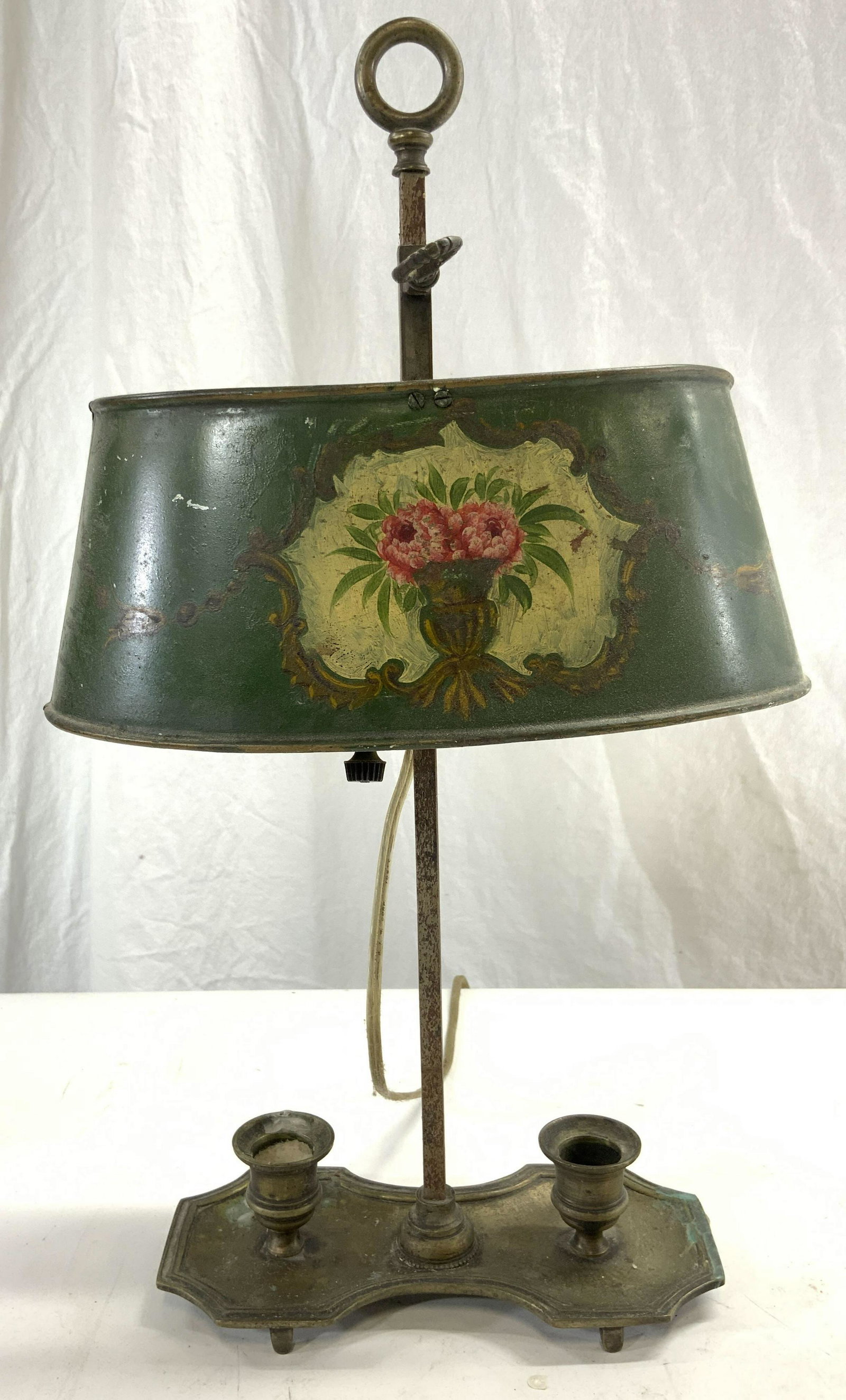 Vintage Toleware Bouillotte Candle Lamp: Lamp is vintage possibly antique. Piece is Toleware appears to be hand painted with floral & leaf in vase detail. Bouillotte has 2 candle areas. Lamp measures approx 17 inches tall 9.75 inches wide 6 