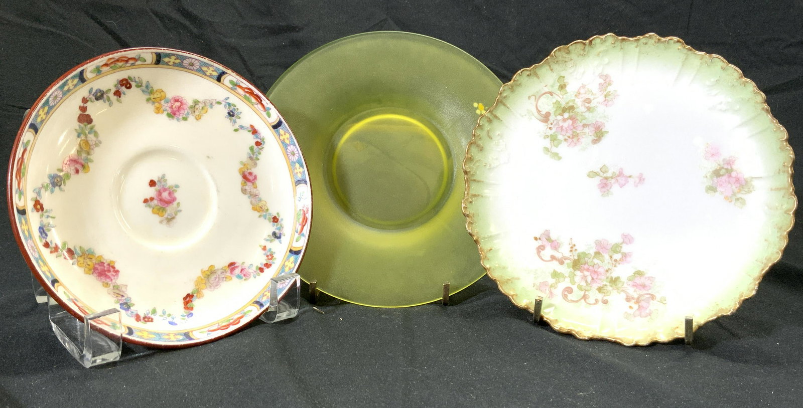 Lot 3 Porcelain & Glass Plates: Lot includes 2 porcelain plates/saucers & 1 art glass plate. 1 saucer reads MINTONS, the other reads LIMOGES FRANCE. Each porcelain dish has multi toned floral and leaf detail. Art glass plate glow. L