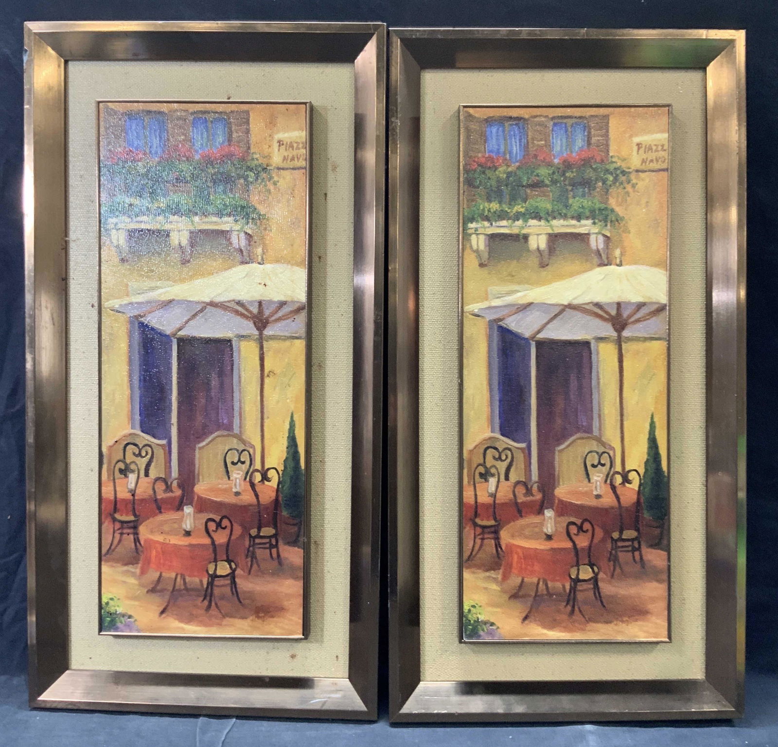 Pair Framed Italian Cafe Lithographs: Pair of framed Italian Cafe lithographs with signs that read Piazz Navo Framed in brown metallic toned plastic framed with linen egdes. Approximately 25 x 13 inches window measures 19 x 7.5 inches Evi