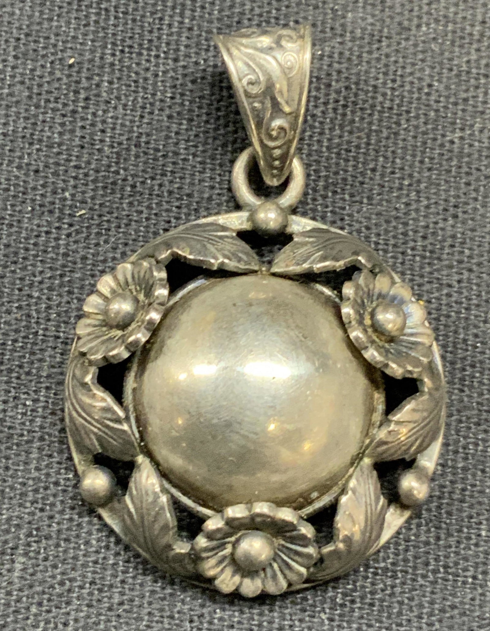 Vintage N.E. FROM DENMARK Sterling Silver Pendant: Vintage N. E. From Denmark sterling silver floral pendant. Designer label to underside, marked sterling 925. Measures approx. 1 inch diameter. Some surface wear consistent with exposure. Total weight 