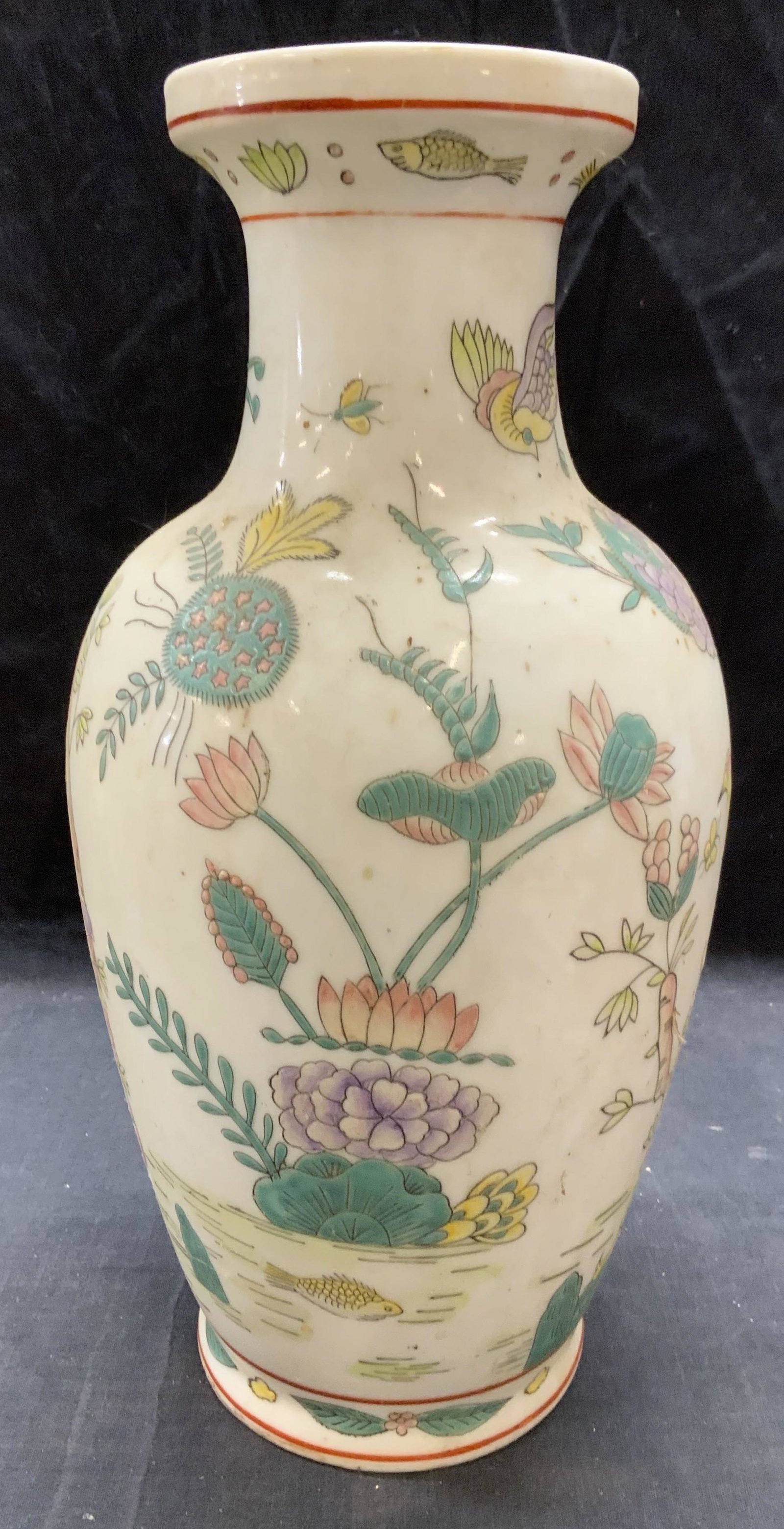 Vintage Asian Porcelain Lotus Vase: Vintage Asian porcelain vase with hand painted lotus, bird, and fish decoration. Drainage hole to base. Chipped and cracked to rim. General surface wear throughout observed, measures approx. 6 inches 