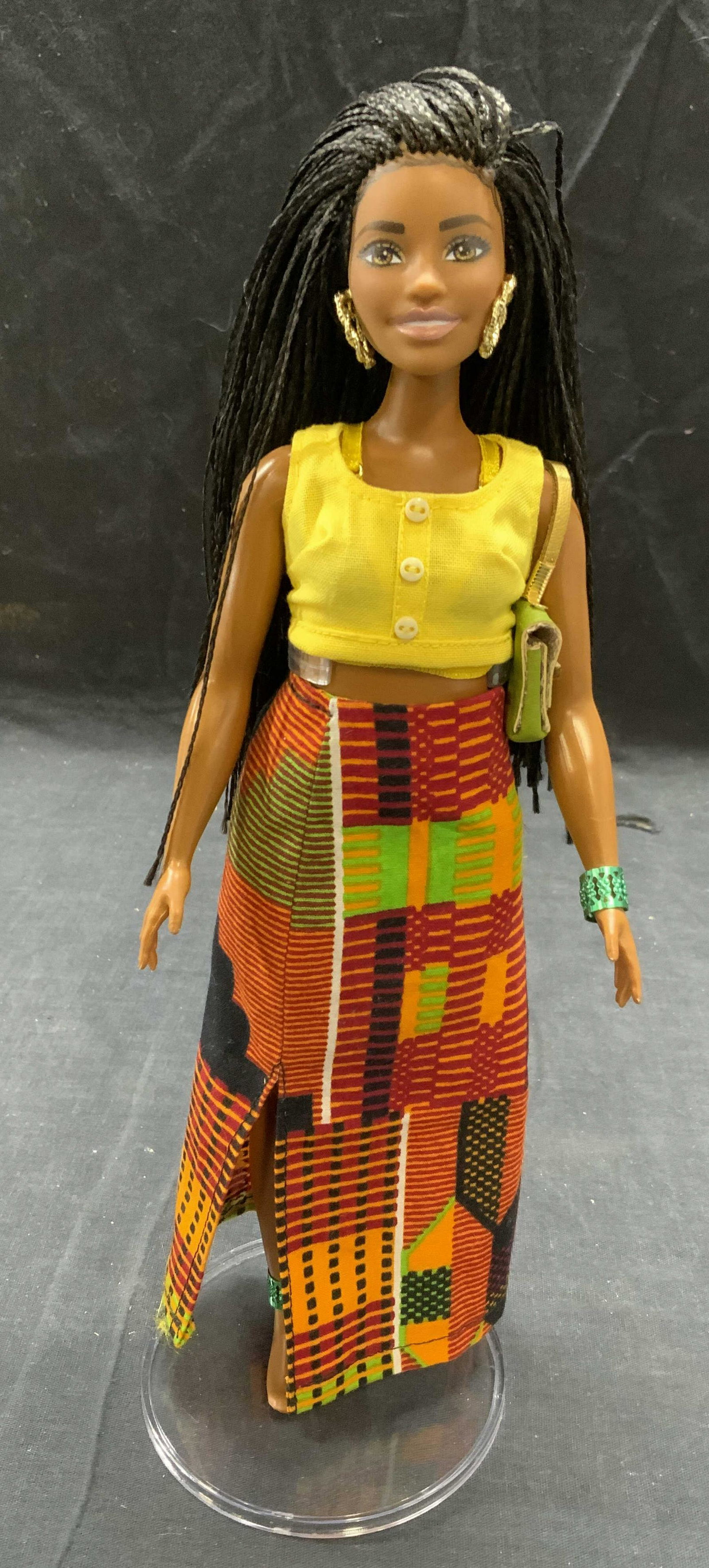 Custom Made Black Fashion Display Doll: Custom made black fashion doll with yellow top, geometric print maxi skirt, and fashion accessories. Trademarked Mattel to back of head. Measures approx. 10.75 inches tall. Some surface wear consisten