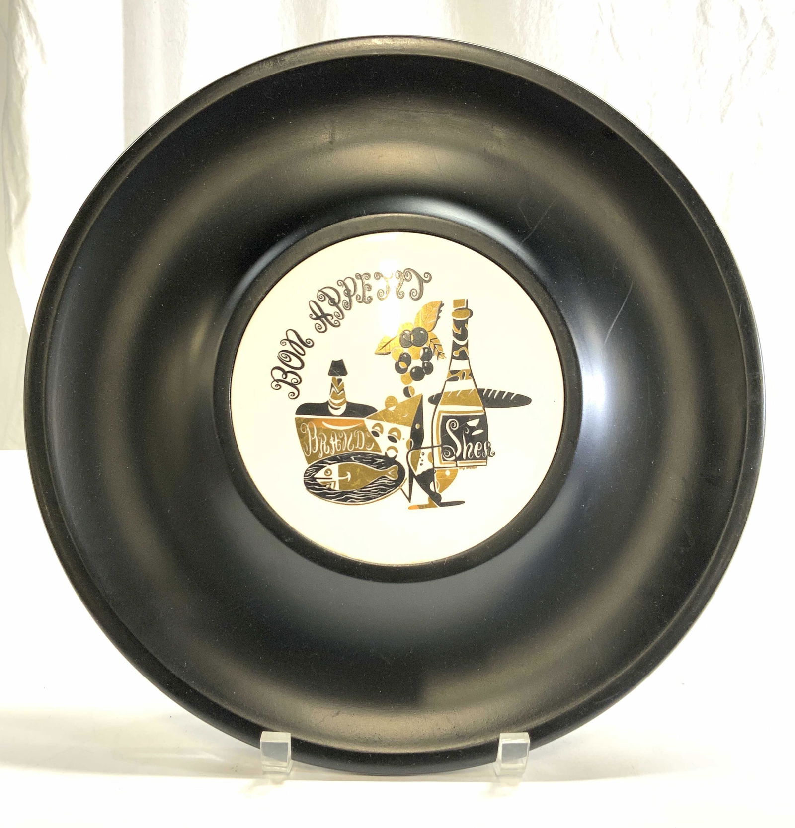 ROWOCO Hors D'oeuvres Plate: Hors Doeuvres plate is marked ROWOCO on underside. Outer area is black toned center is white with black & gold food & wine detail and reads BON APPETIT. Piece measures approx 13.25 inches diameter. Pl