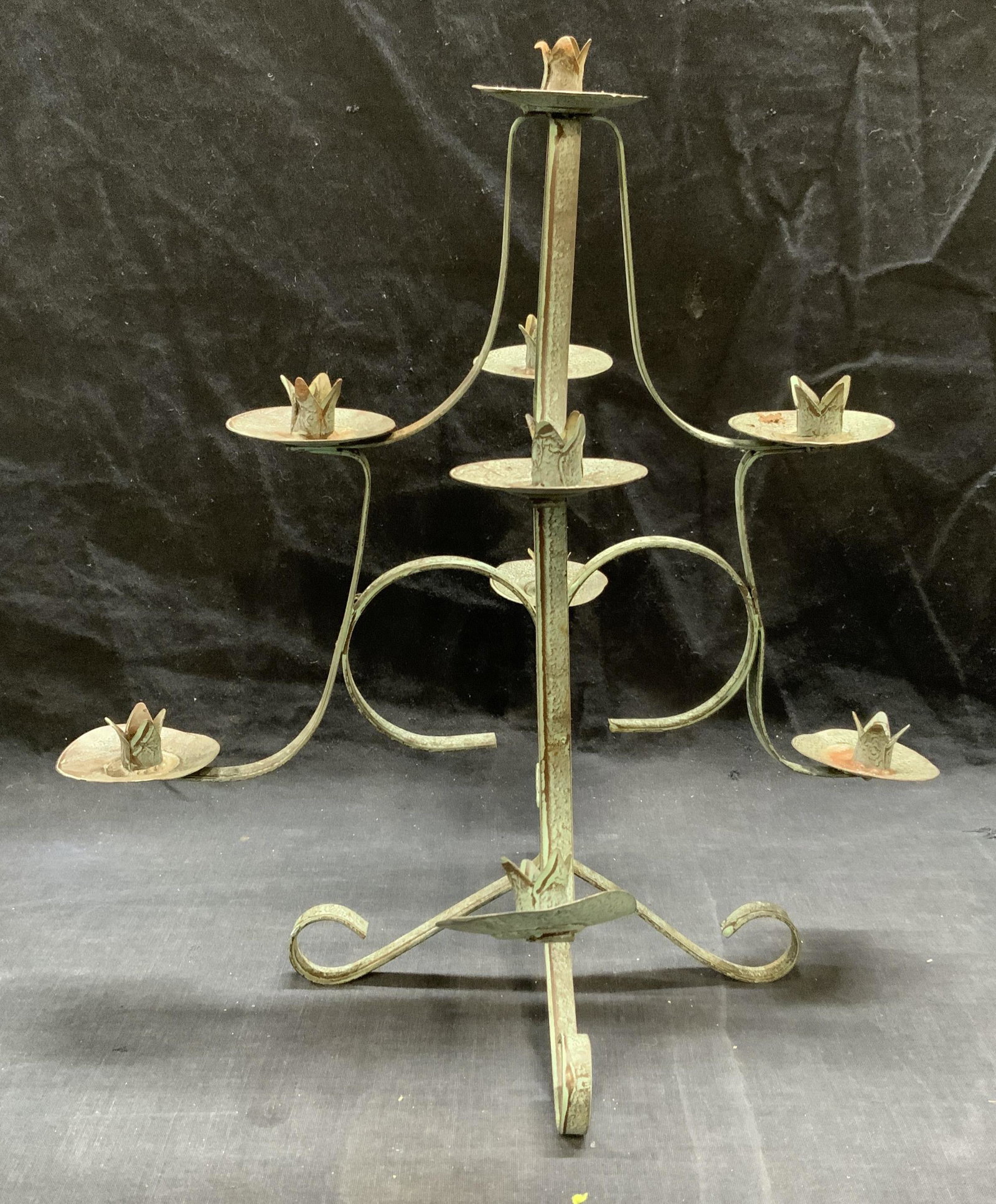 Vintage Iron 8 Arm Candelabra: Vintage iron 8 arm candelabra. Surface wear and bending observed. Measures approx. 13 inches wide and 13 inches tall. Candelabra, iron candelabra, 8 arm candelabra, vintage candelabra, table decor, ta
