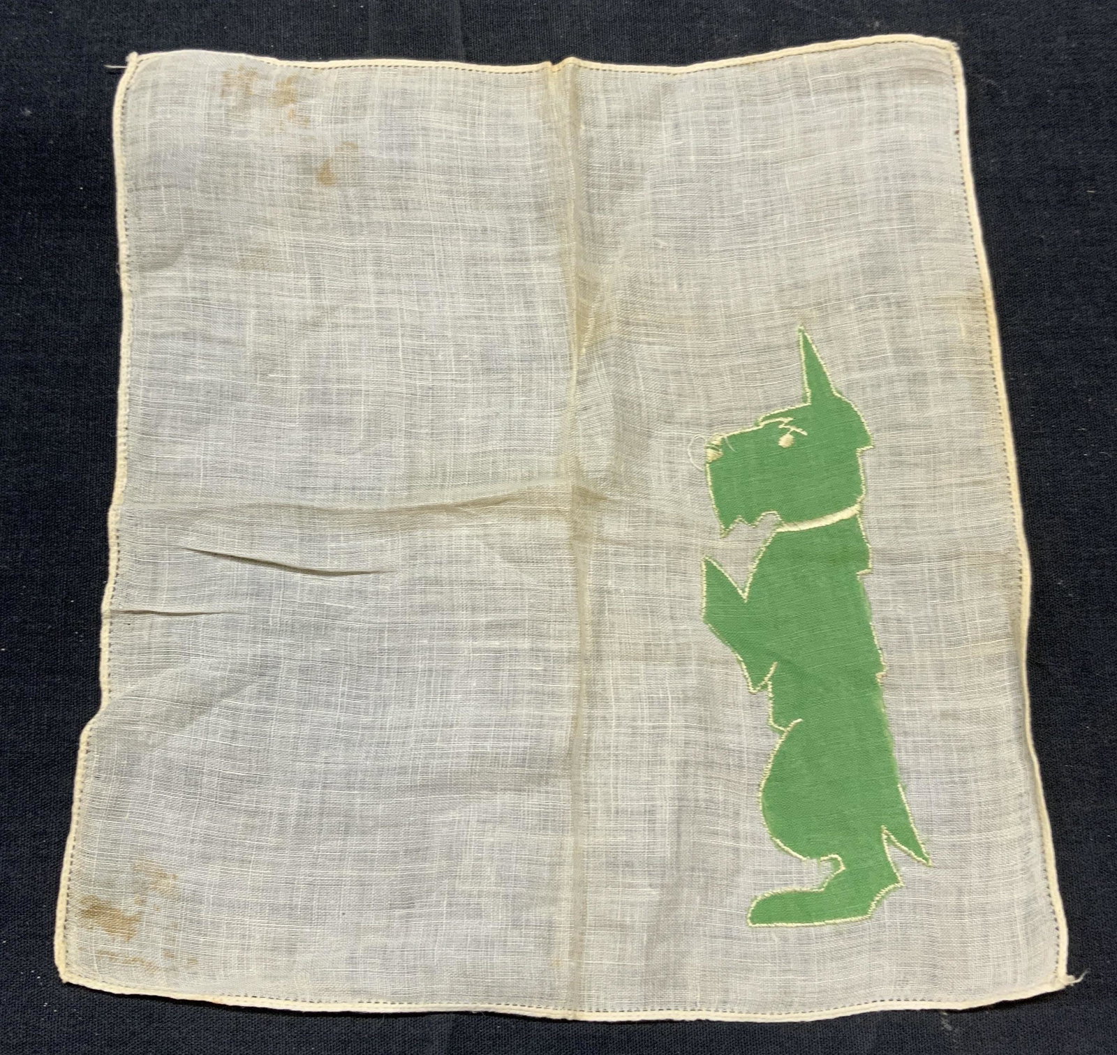 Vintage White/Green Scottie Dog Handkerchief: Vintage white and green handkerchief with Scottie dog motif. Material feels like cotton. Some wear to fabric consistent with exposure, blemishes observed. Measures approx. 8 x 9 inches. Handkerchief, 