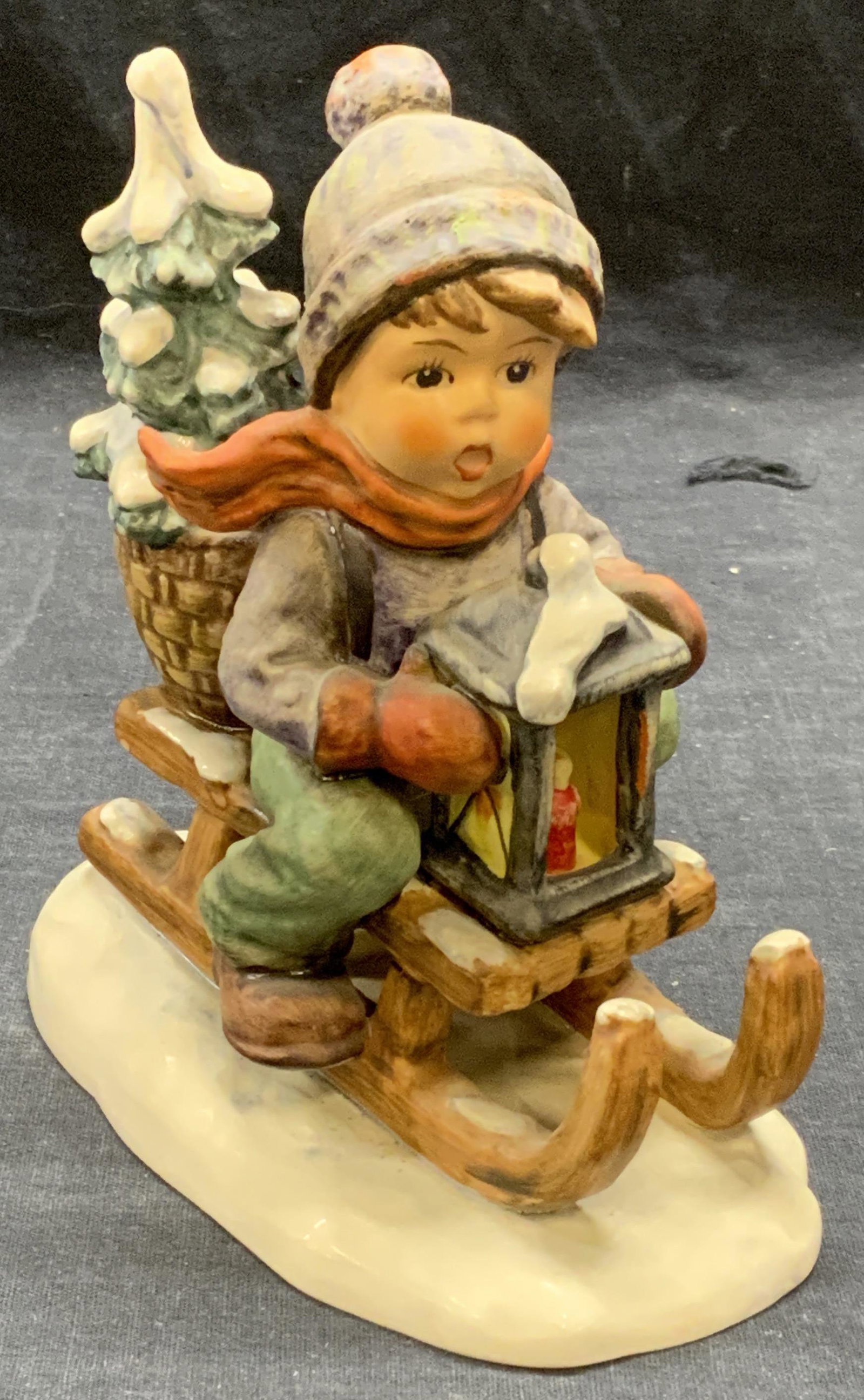 GOEBEL HUMMEL Ride Into Christmas Figurine: Vintage 1971 GOEBEL MJ Hummel Ride Into Christmas porcelain figurine. Trademarked to underside. In good condition, some crazing observed. Measures approx. 5.25 x 3 x 5.75 inches. GOEBEL, Hummel, mj Hu