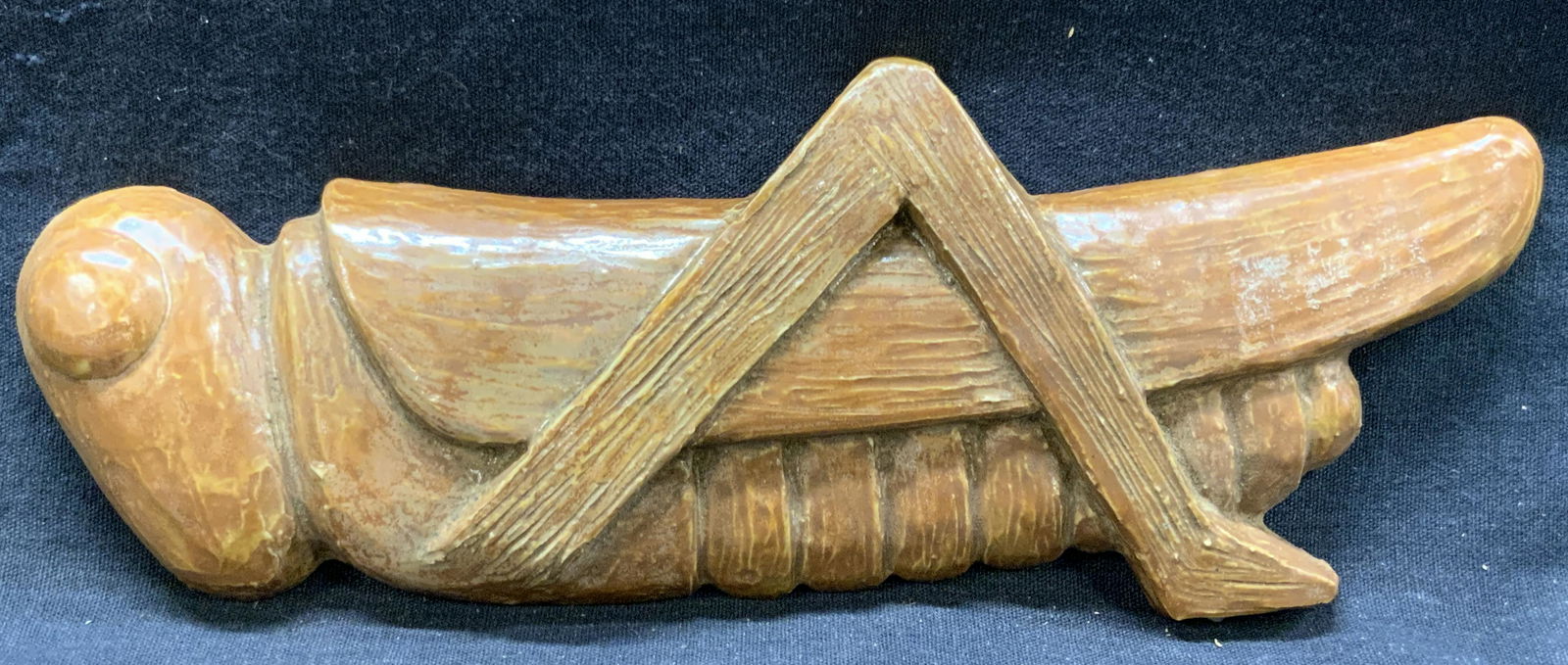 Vintage Pottery Cricket Table Accessory: Vintage pottery tabletop accessory made to resemble a cricket with tan toned glazing on top. Approximately 9 inches long and 3 inches wide. Minor wearing due to vintage age and use. Vintage pottery de