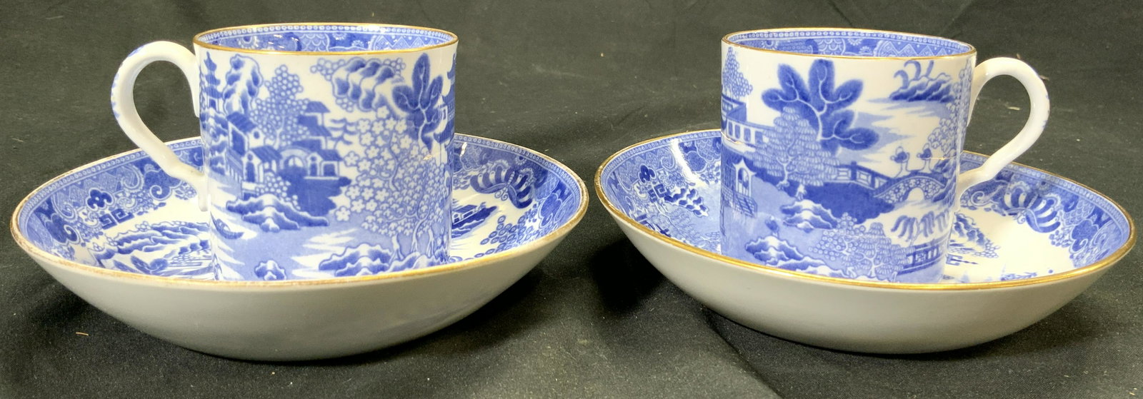 SPODE Vntg Set 4 Porcelain Teacups & Saucers: Undersides of each piece are marked SPODE. Lot includes 2 teacups & 2 saucers. Esch piece is white with blue toned landscape detail with Asian architecture. Each piece has gilt rim. Saucers Measures a