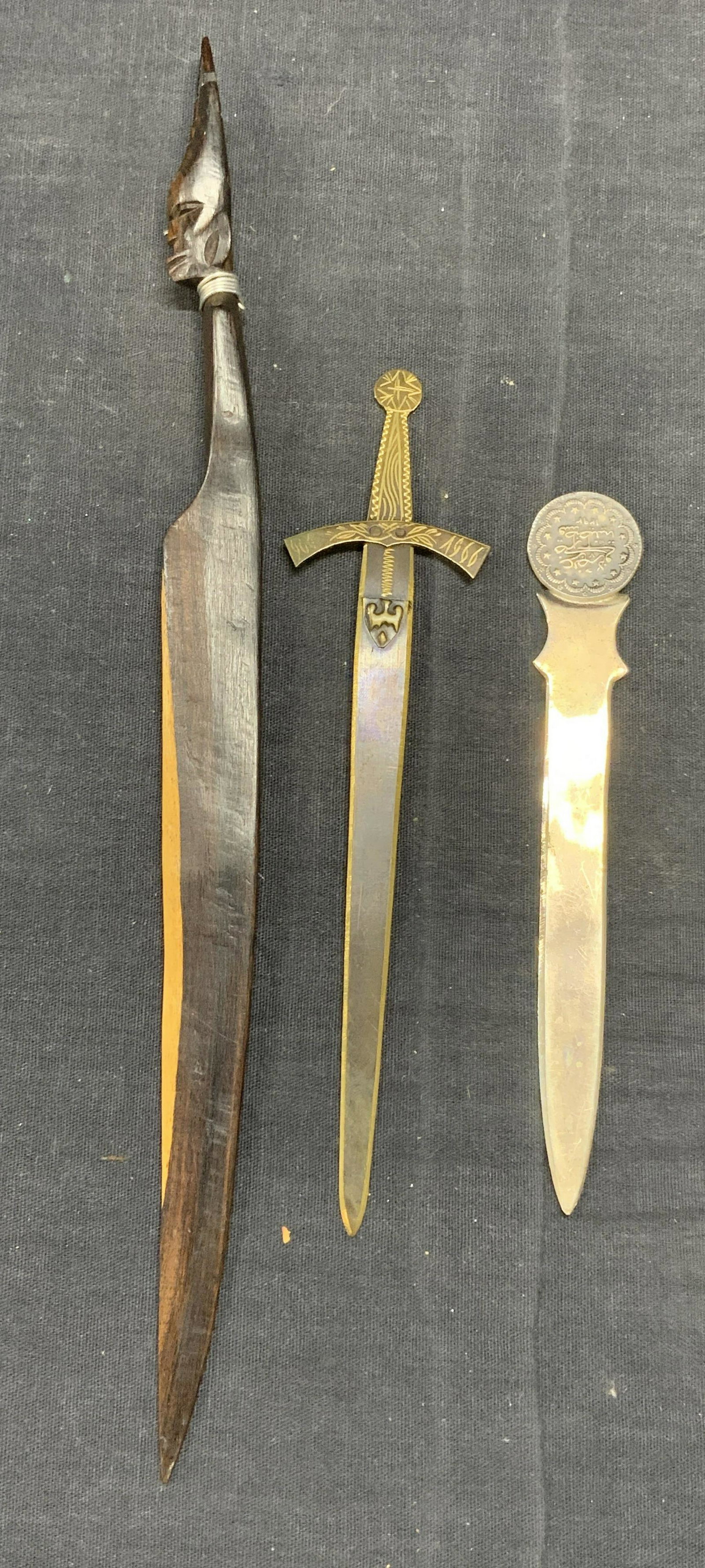 Lot 3 KENEDY 900 Silver Letter Opener, More: Lot of 3 letter openers. 1 vintage KENEDY letter opener with script. Marked 900 and trademarked to underside. Measures approx. 5 5/8 inches long. Total weight .73 ozt. 1 brass sword motif letter opene