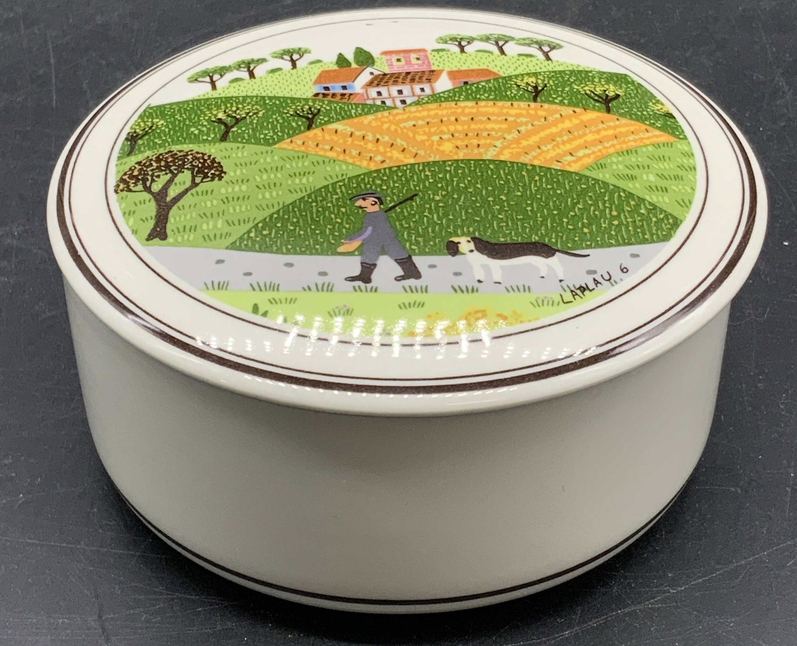 VILLEROY & BOCH Laplau Art Porcelain Trinket Box: Vintage VILLEROY & BOCH Laplau Art Design Porcelain Trinket Box. Lidded porcelain trinket / candy box. Obverse features Laplau art depicting a man with his dog among farmland. Underside reads VILLEROY