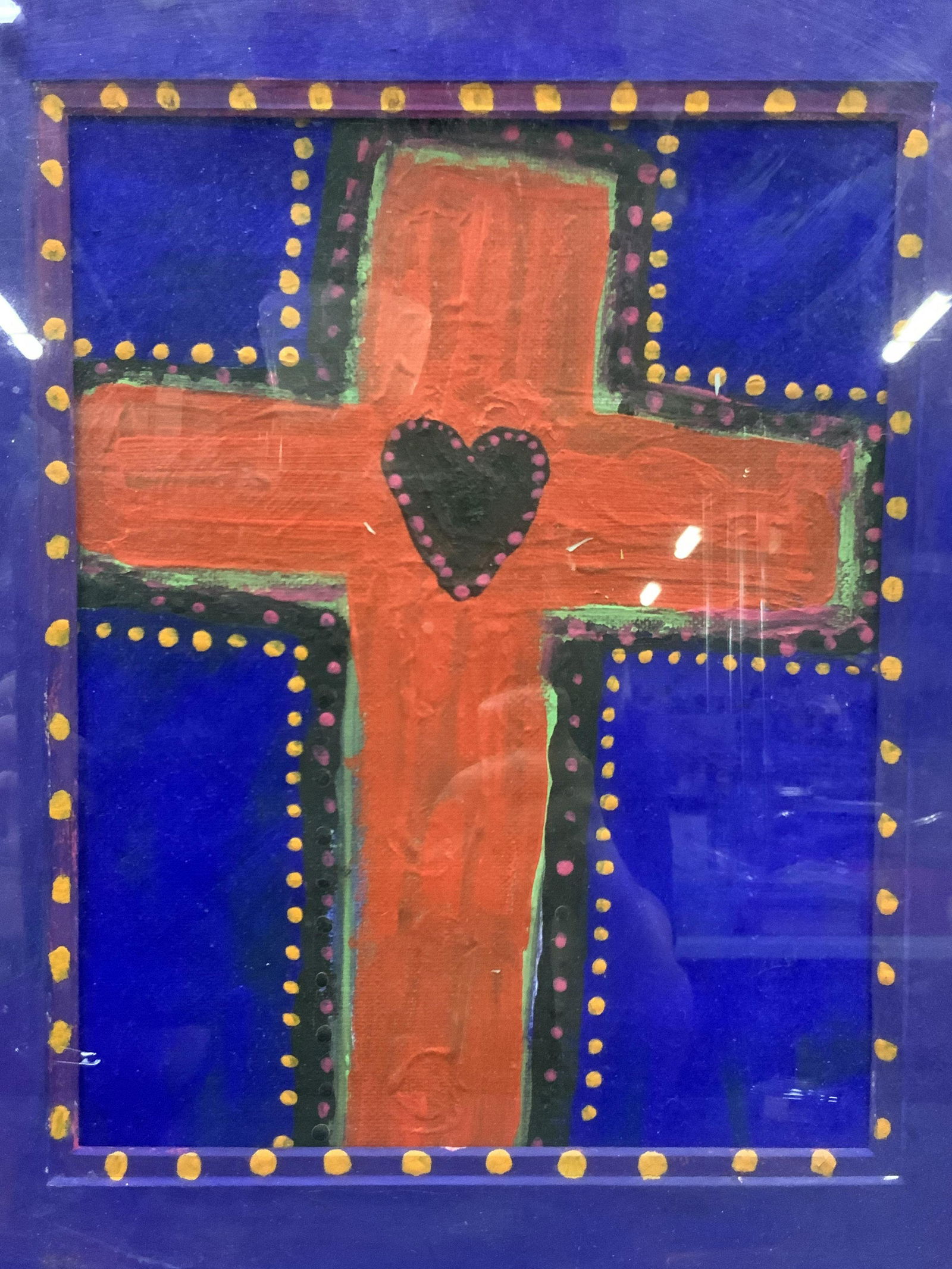 Framed Acrylic Cross Painting: Framed acrylic on canvas of a Red Cross. Framed in blue painted wooden frame with purple mat board Approximately 16.5 x 13.5 inches window measures 9.25 x 7 inches. Moderate intentional wearing to fra