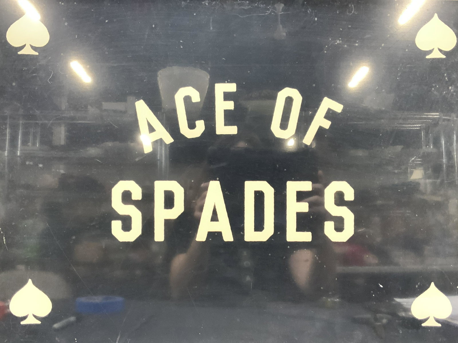 Framed Ace Of Spades Lithograph: Frame in silver toned metal frame. Reads in White Ace of spades and lower half reads Three potato four, printer in USA Approximately 18 x 24 inches window measures 17.5 x 23.5 inches Moderate wearing 