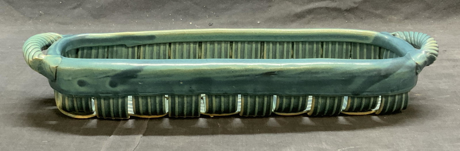 PARMENTIER Blue Pottery Basket: Jim & Shirl PARMENTIER Pottery ribbed embossed woven basket in blue. Trademarked to underside. In good condition. Measures approx. 13 x 4 x 2 inches. Property of Palm Beach, Florida Estate. Jim and sh
