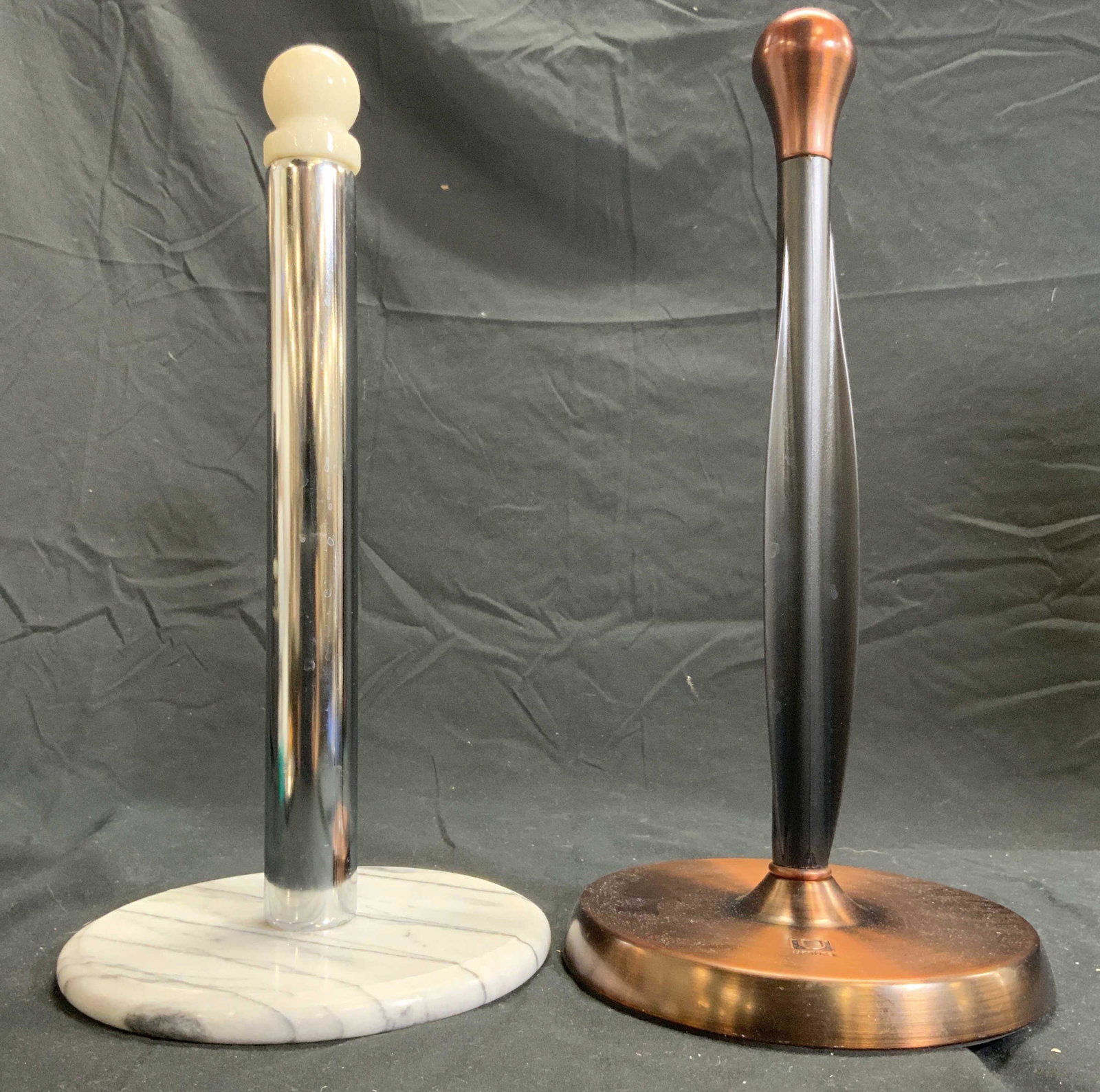 UMBRA Lot 2 Metal & Marble Paper Towel Roll Holder: One paper towel roll holder is trademarked UMBRA. Piece is copper toned and brushed metal. One paper towel roll holder has metal shaft with circular shaped marble base and top. Umbra paper towel roll 