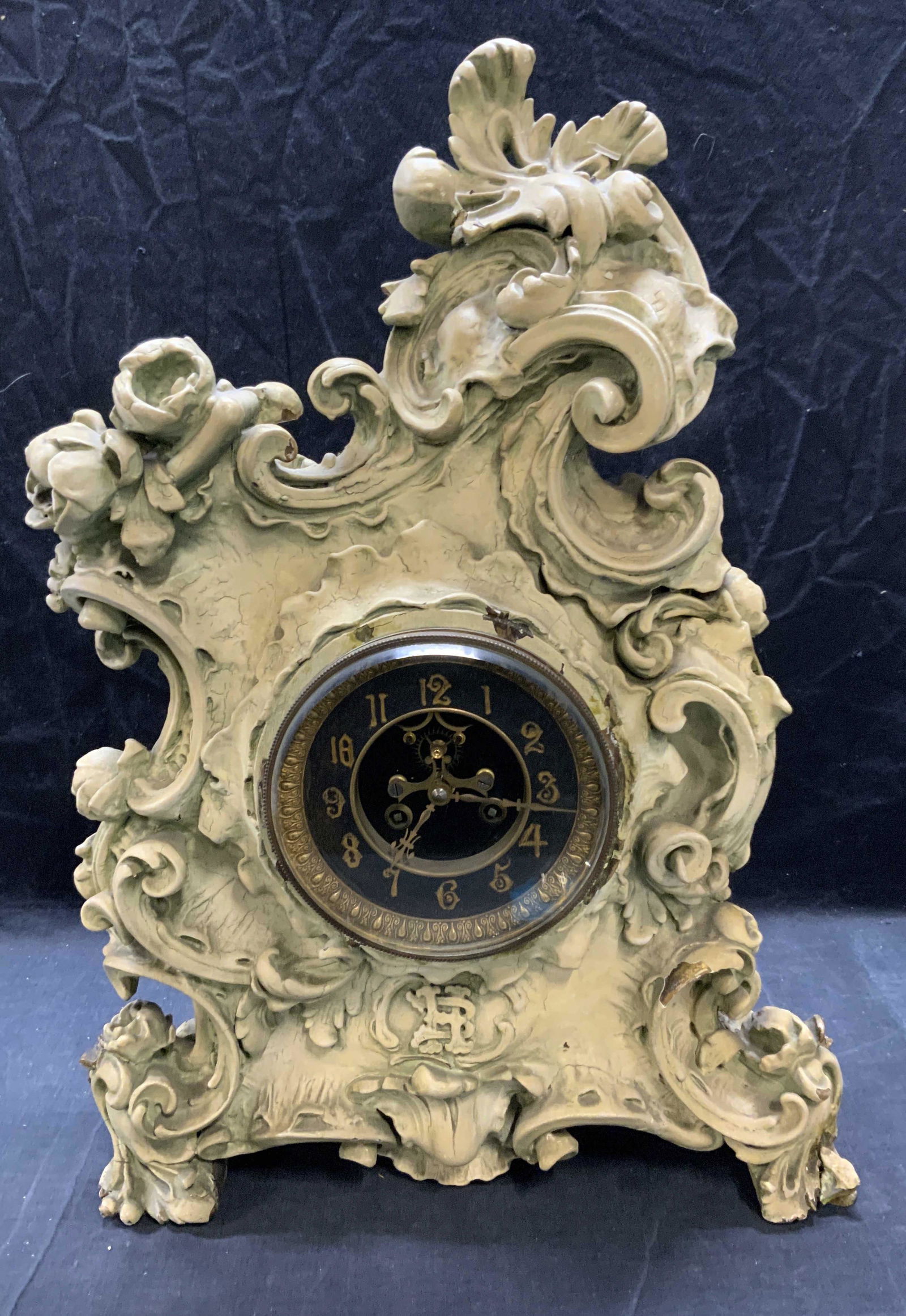Vintage Wood Scroll Mantel Clock: Vintage, possibly antique, cream toned wood scroll mantle clock. Not tested for function. Surface wear consistent with exposure, chipping and crazing observed. Measures approx. 15 x 6 x 21 inches. Inc
