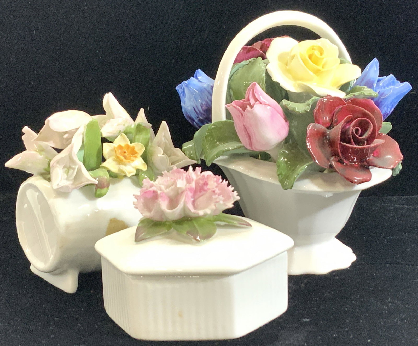 Lot3 AYNSLEY Porcelain Decorative Acces. England: Group of Aynsley England Hand Formed Porcelain flower posies, one is a rose flower basket ( 4.5 H x 5.5 L x 4 in. W) , wheel barrel ‘January Snowdrop flowers 3 x 2.5 x 3 in.,and a white porcelain bo
