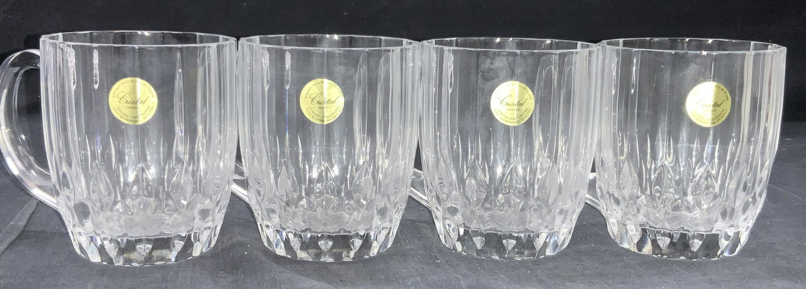 Set 4 Faceted Leaded Crystal Mugs, France: Set of 4 clear leader crystal mugs with side handles and faceted and groove cut bodies. Marked on stickers Genuine lead crystal crystal France. Approximately 4 inches tall and 3 inch diameter. Moderat
