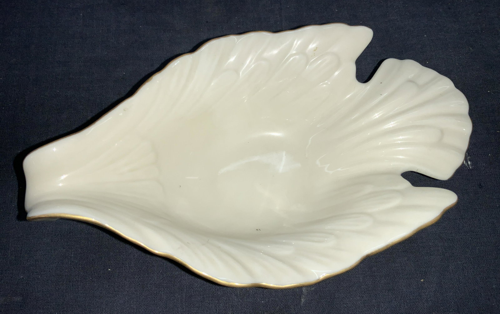 LENOX 24 K Gilt Dove Porcelain Dish: Marked Lenox, hand decorated with 24 k gold. Dish made to resemble a dove with lipped rim that resembles the head of the bird and wing details. Approximately 2.5 inches tall and 8 inches long. Minor w