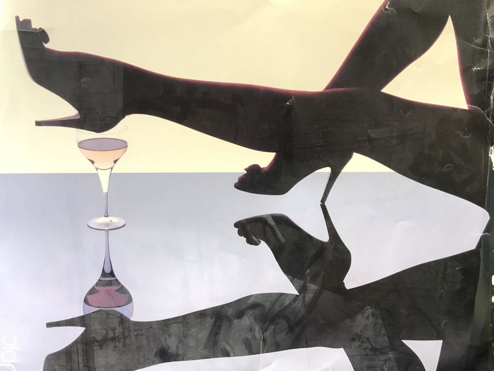 Yuri Dojc Fashion Heels Lithograph: Marked on upper left corner Yuri Dojc Depicts a pair of legs with high heels on over a glass of wine and that image being reflected. No frame Approximately 26.5 x 27 inches. Evident wearing and tears