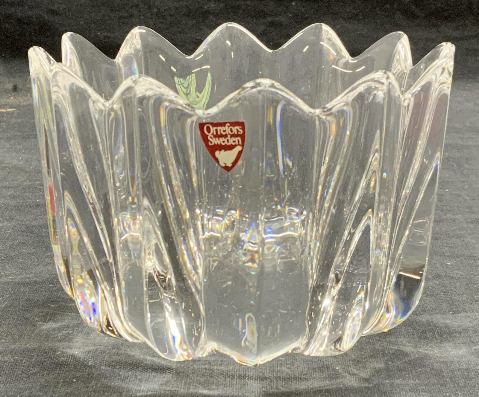 ORREFORS Cut Crystal Bowl Sweden: Orrefors cut crystal bowl. Some surface wear consistent with exposure. Measures approx. 4 5/8 inches diameter and 3.25 inches tall. Trademarked and sticker and signed to underside. Crystalware, crysta