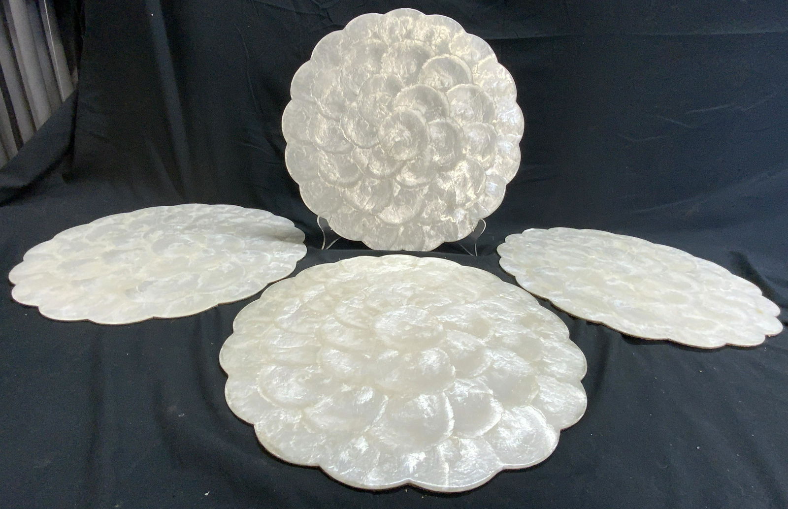 Set 4 Vintage Shell & Cork Placemats: Lot includes 4 placemats. Each are cream toned shell detailed with shined finish. Underside are each cork. Each placemat measures approx 14 inches wide. Placemats, Shell placemats, vintage placemats,