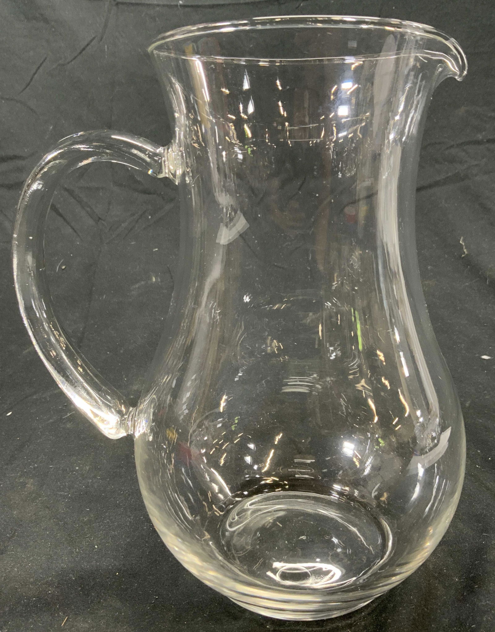 Glass Pitcher Ewer Vessel Kitchenware: Pitcher is glass, possibly hand blown. Handle appears to be molded glass. Piece measures approx 8 inches tall 5 inches wide 6.5 inches deep. Glass pitcher, vessel, Ewer, upcycle vase, kitchenalia, kit