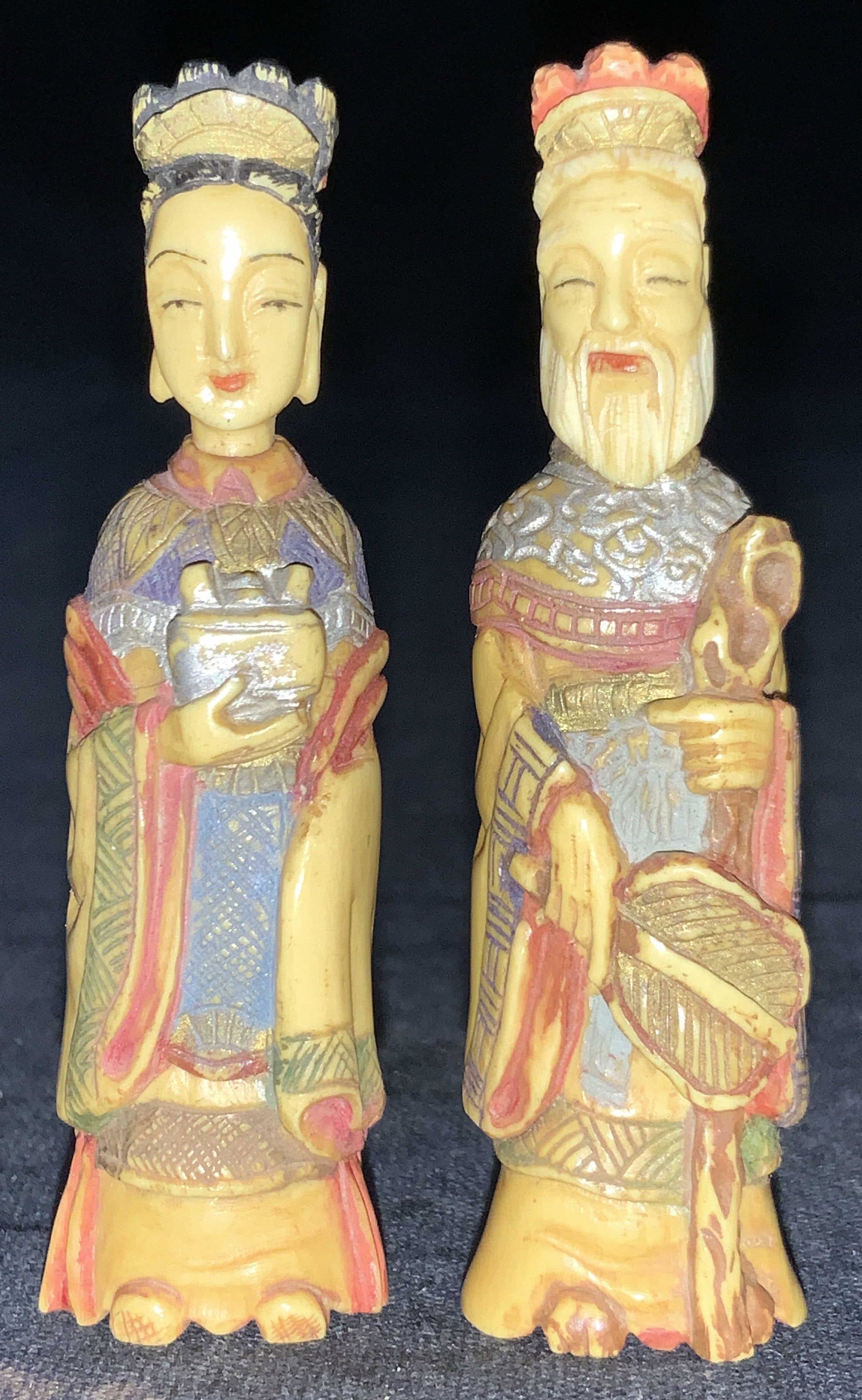 2 Hand Carved Emperor & Empress Snuff Bottles: 2 hand carved and painted bone snuff bottles, man to resemble an empower and empress. Heads of bottles are removable and affixed to carved spoons on ends. Approximately 2.5 inches tall. Condition is c