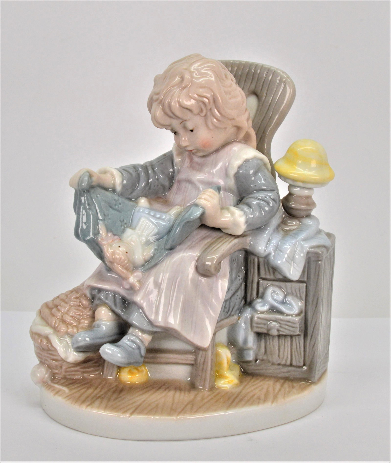Lisi Martin by Dolfi Ceramic Statue Girl W Doll: This is a very sweet piece. It depicts a young girl seated with her doll in a blanket. It stands 5.5 tall 5 wide and 3.5 deep. There are no visible scratches or chips. -nb