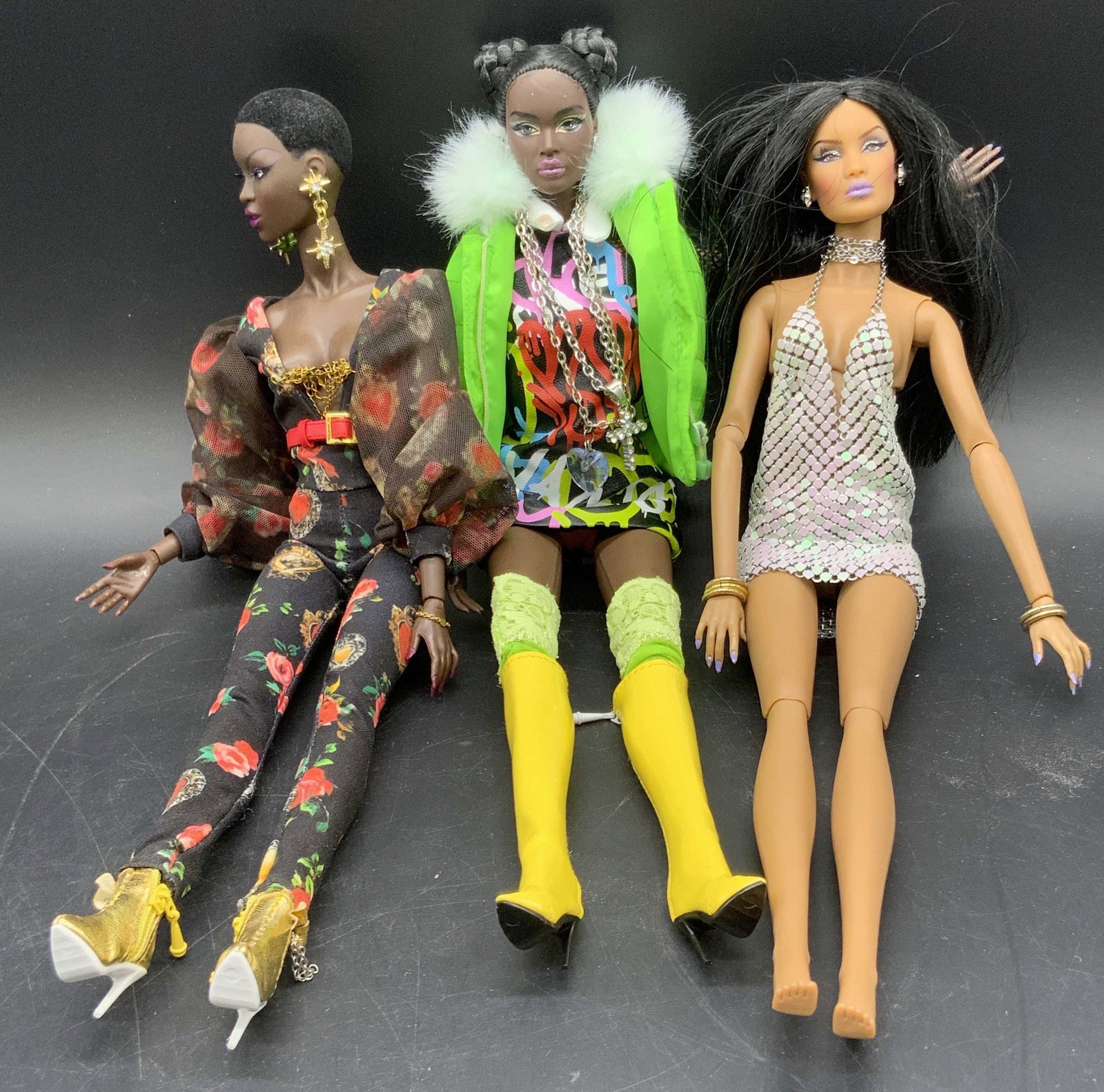 3 INTEGRITY 2016 & 2012 Articulated Fashion Dolls: Two INTEGRITY 2016 dolls and one INTEGRITY 2012 doll. Marked INTEGRITY on the reverse of dolls. Dolls feature articulated limbs. Colorful outfits crafted from a variety of materials. Dolls are similar