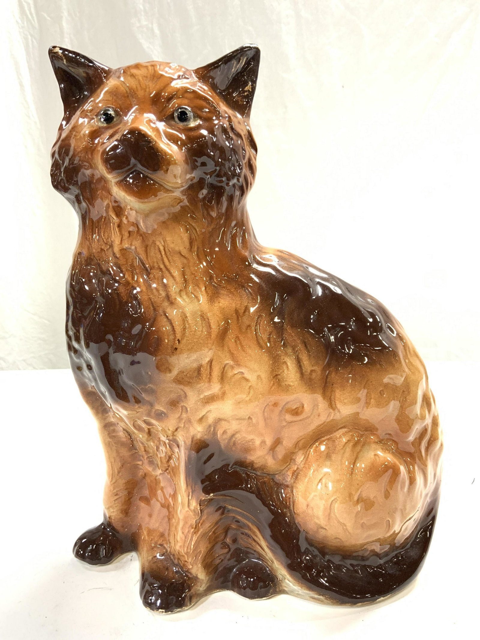 HANLEY ENGLAND Vintage Porcelain Cat Figure Statue: Underside is marked HANLEY ENGLAND. Piece depicts a seated tan and brown toned cat. Piece measures approx 12.5 inches tall 9.5 inches deep 5.5 inches wide. Cat, porcelain cat, Hanley porcelain, Hanley