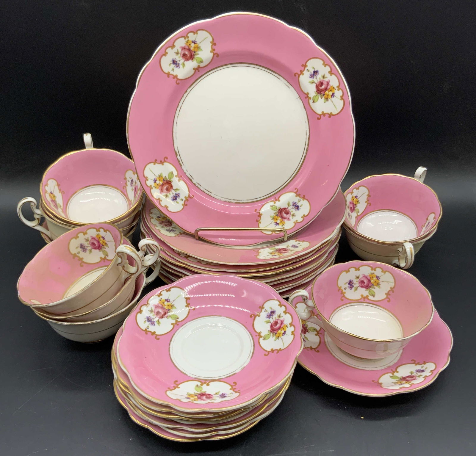 St27 FOLEY CHINA Vintage Teacups & Plates, England: Vintage Foley China. Ten tea cups, eight saucers, nine plates. Pink, white, and gold hues. Floral vignette designs. Slight scallop to the edges. Teacups measure approx 2H x 4.5W in. Larger plates meas