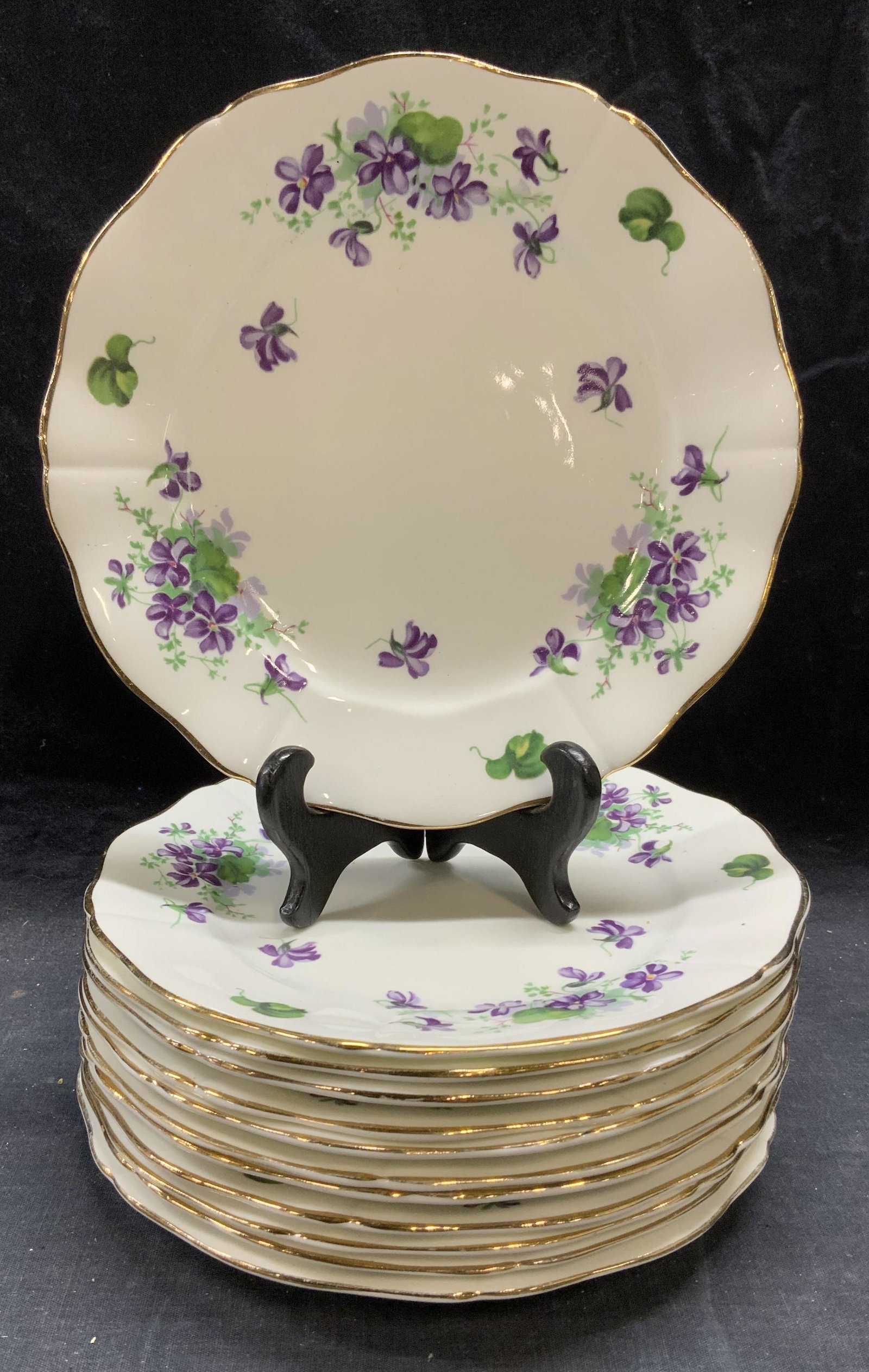 Set 12 ADDERLEY Floral Bone China Plates England: Set of 12 vintage ADDERLEY bone china plates with floral motif and gilt decoration. All pieces trademarked to undersides. Surface wear consistent with exposure, crazing observed to pieces. Measure app