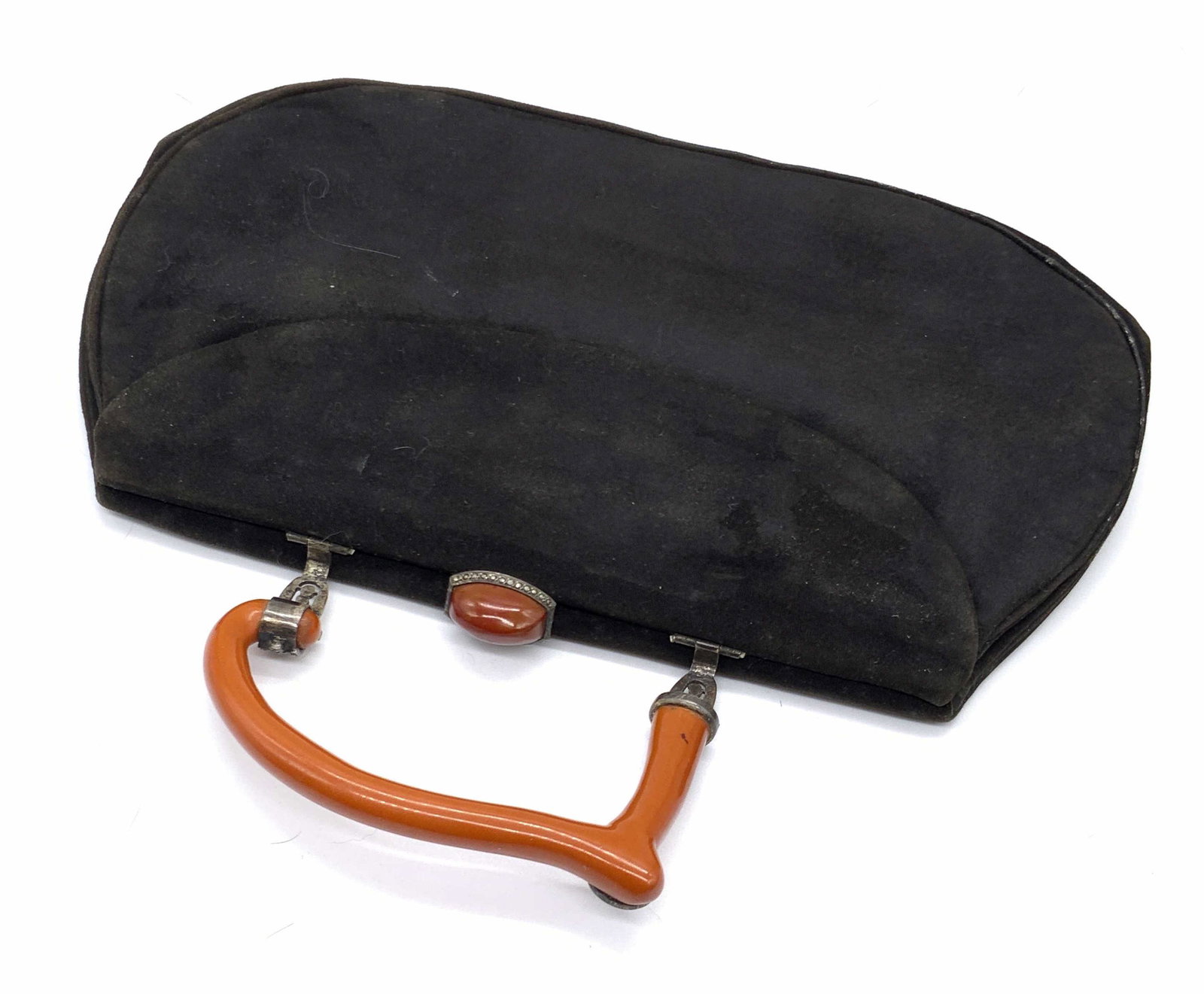 Vintage Black Suede Marcasite Handle Purse: A vintage black suede style purse with a amber toned composite handle. Silver tone hardware studded with marcasite. Clasp closure features a amber hued costume cabochon. Bezel set, flanked by marcasit