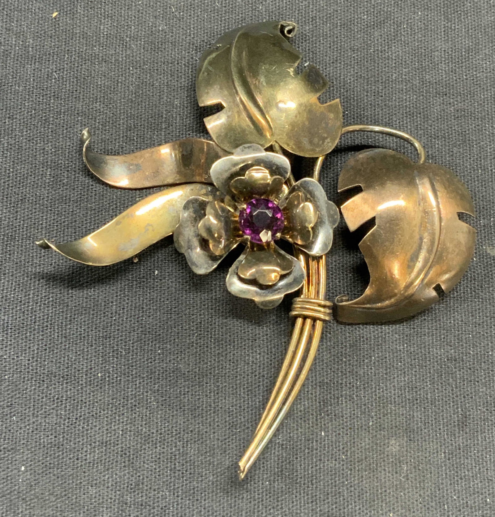 Vtg XL HARRY ISKIN 10k Gold Plated Floral Brooch: Vintage Harry ISKIN 10k gold plated floral brooch with purple crystal decoration. Marked 1/20 10k to underside. Designer hallmark to underside. Hinge pin to underside. Surface wear consistent with exp