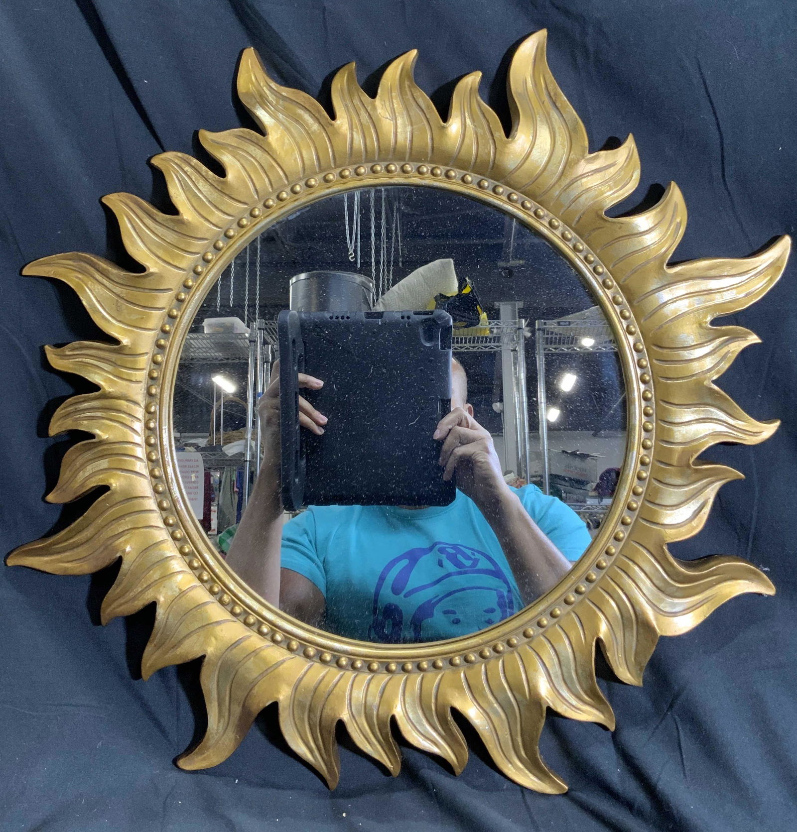 Giltwood Sunburst Frame Wall Mirror: Wall mirror has Giltwood sunburst frame. Piece measures approx 22 inches diameter. Mirror, wall mirror, sunburst mirror, Giltwood mirror, wall decor, home decor. Chips present. 6 Art Wall