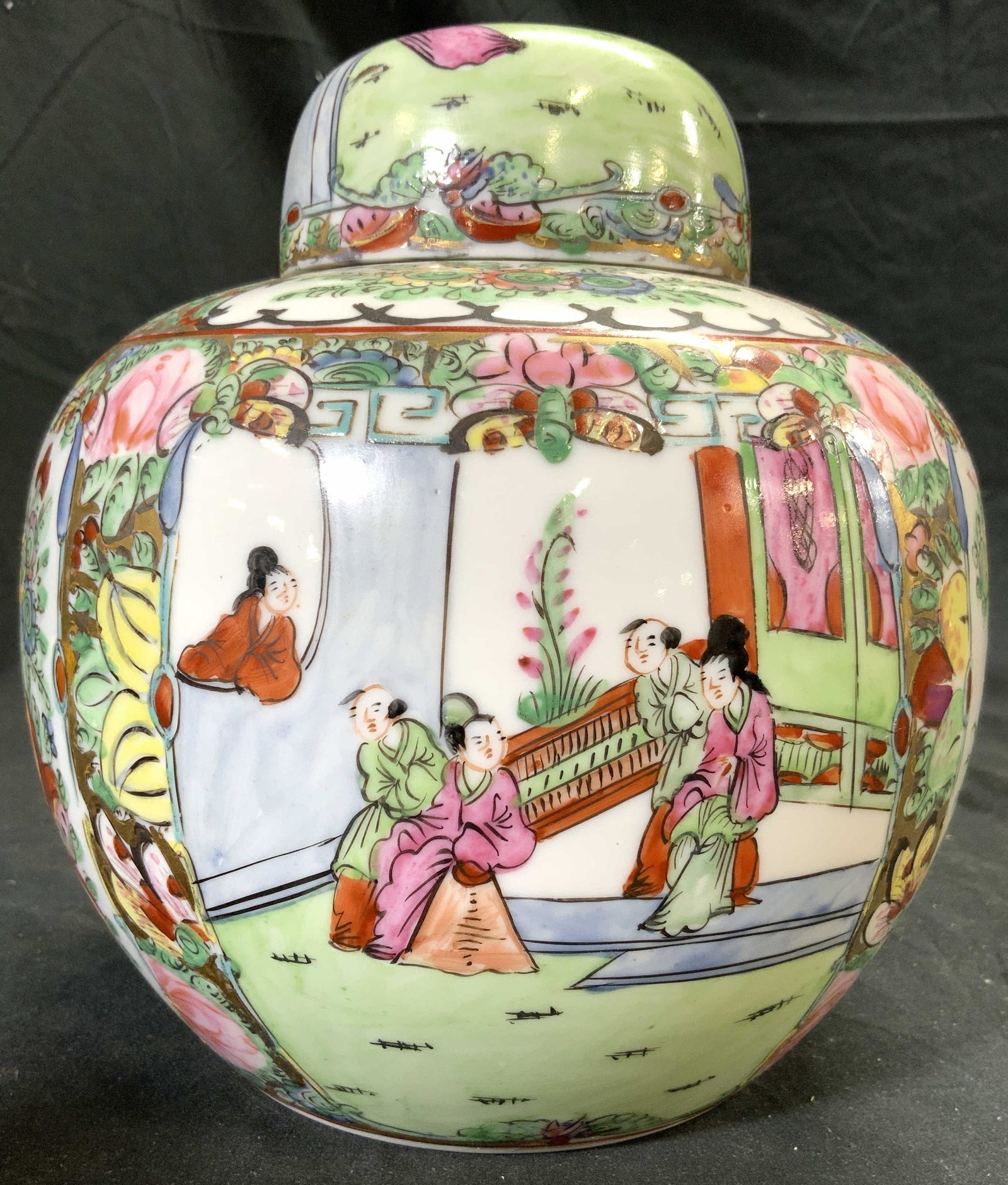 Vintage Lidded Rose Medallion Porcelain Ginger Jar: Ginger jar has rose medallion detail. Piece is porcelain and hand painted with intricate multi toned floral, leaf & figural detail. Ginger jar is includes lid. Piece measures approx 7.5 inches tall 7 